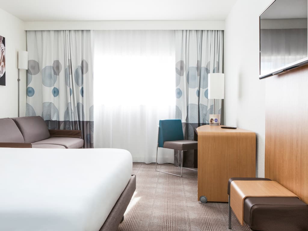 Double bed suite at Novotel Saint Quentin en Yvelines