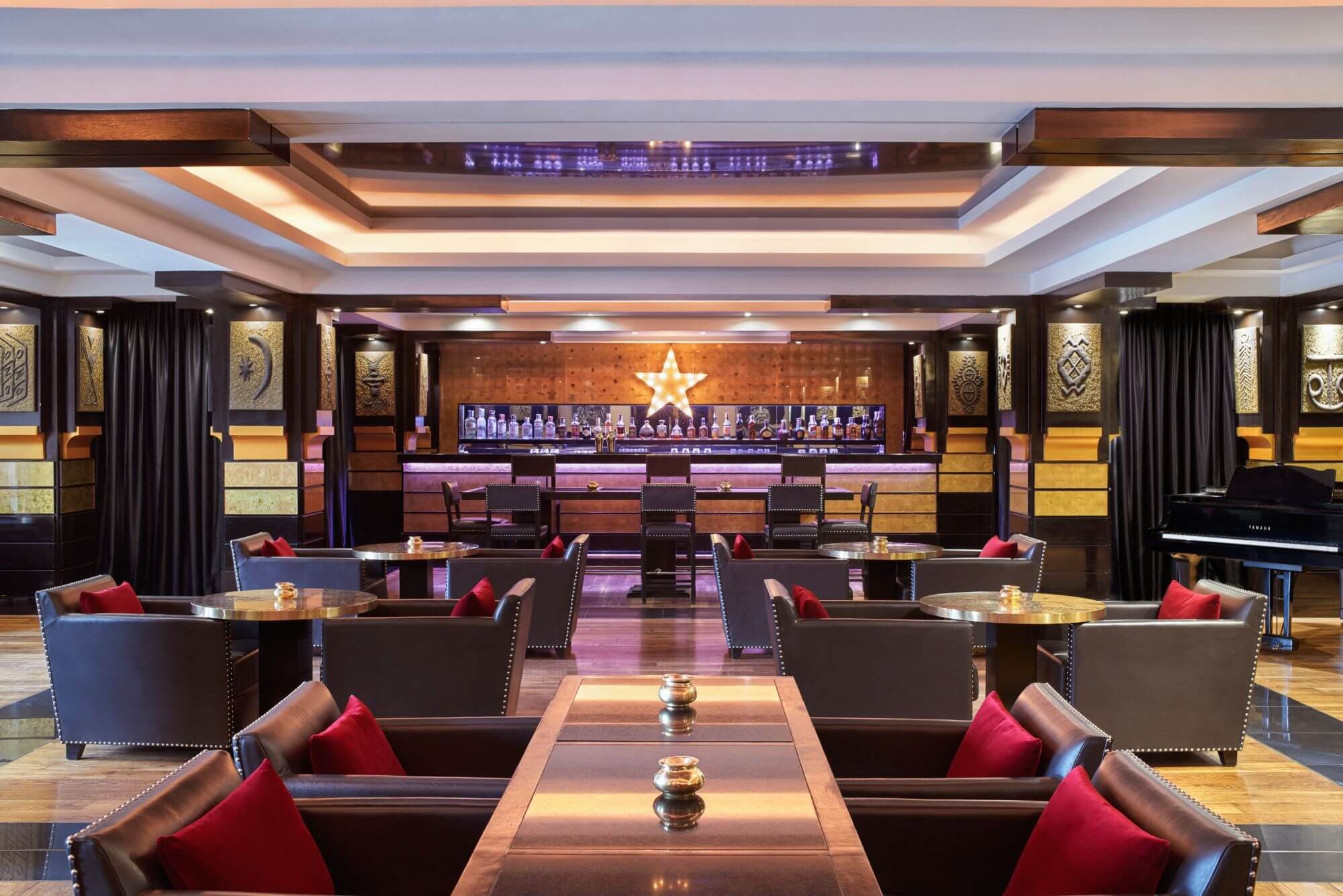Indoor dining room and bar at Hotel & Ryads Barrière Le Naoura
