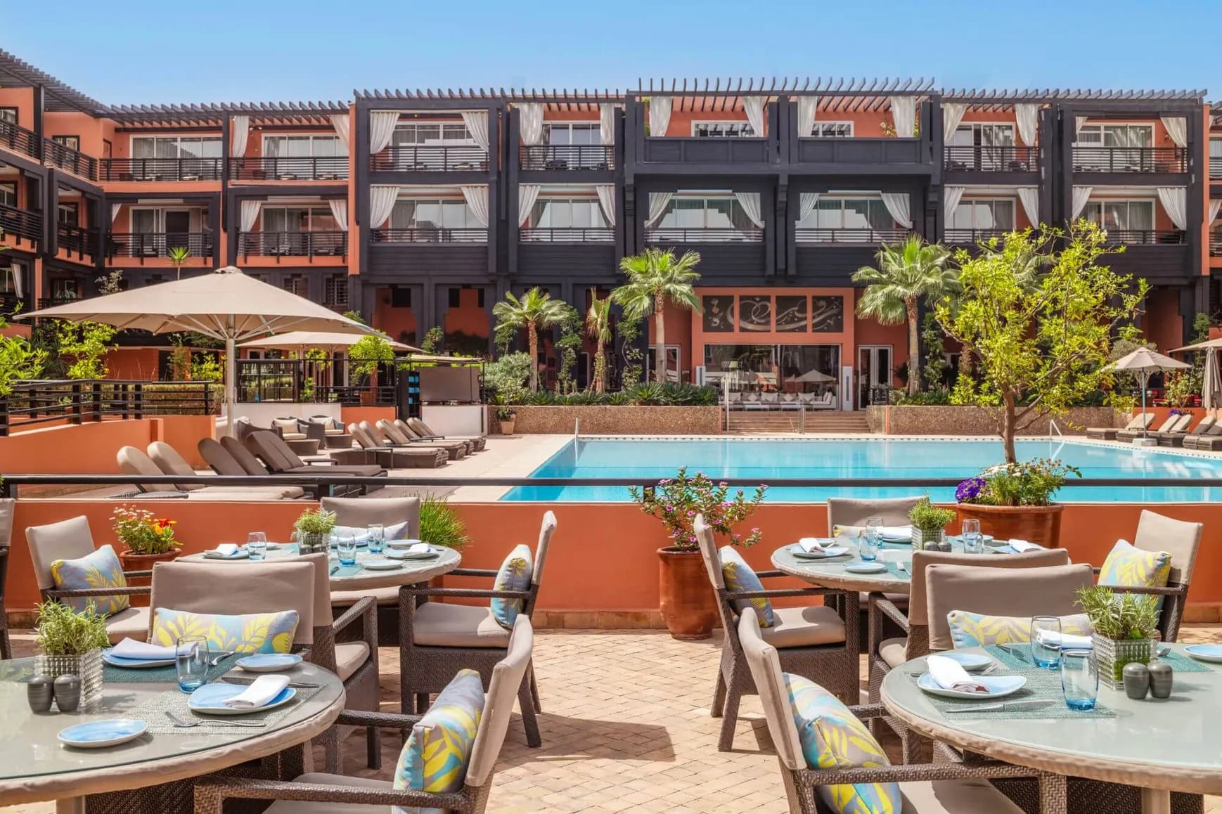 Poolside dining at Hotel & Ryads Barrière Le Naoura