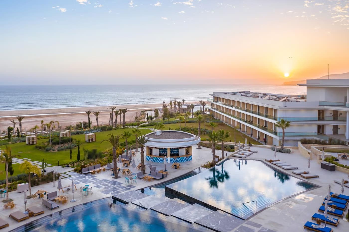 Overhead view of the sun setting above Hyatt Regency Taghazout Bay