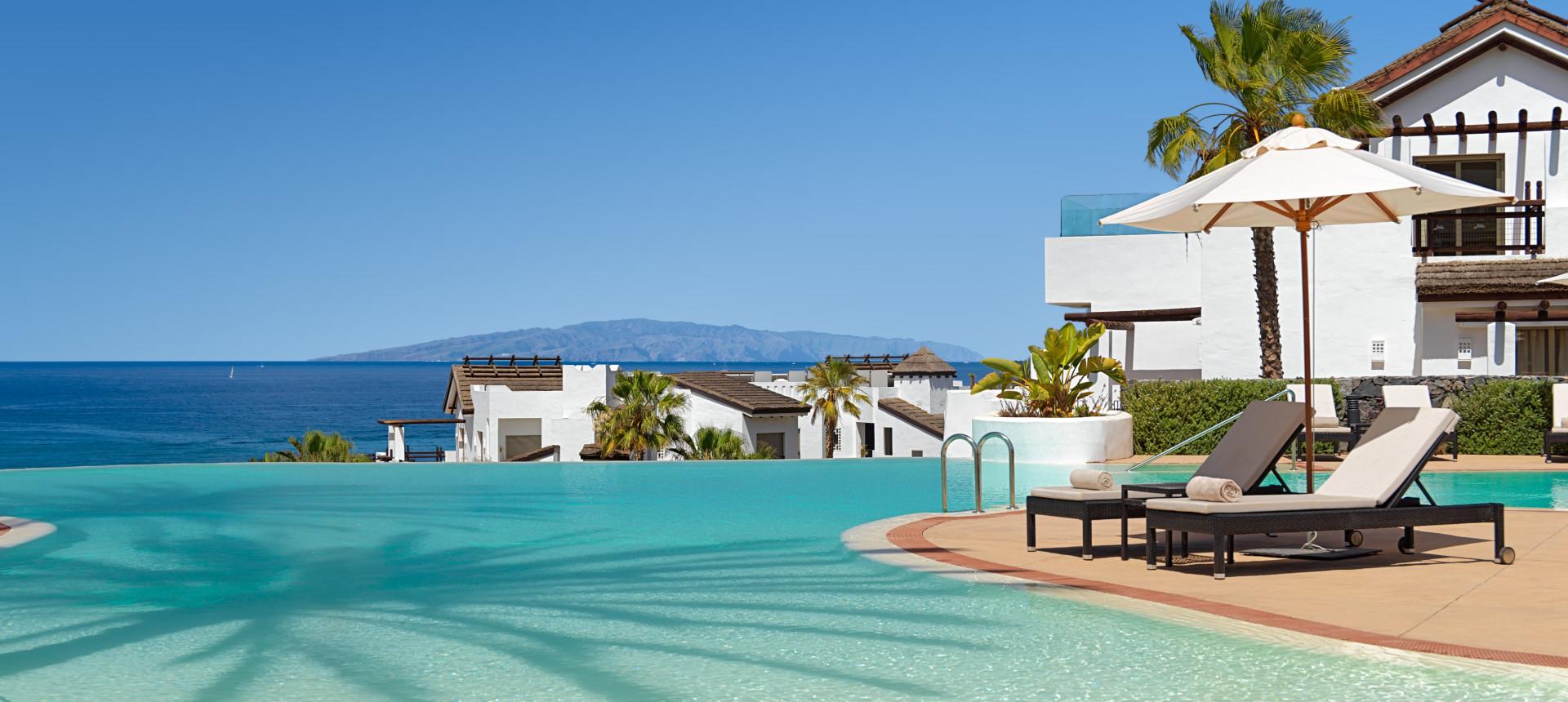 Outdoor swimming pool with coastal views at Las Terrazas de Abama