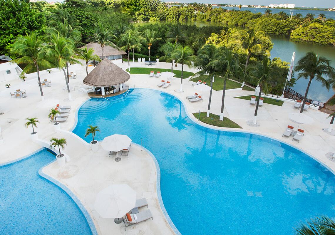 Overhead view of the outdoor swimming pool at Le Blanc Spa Resort