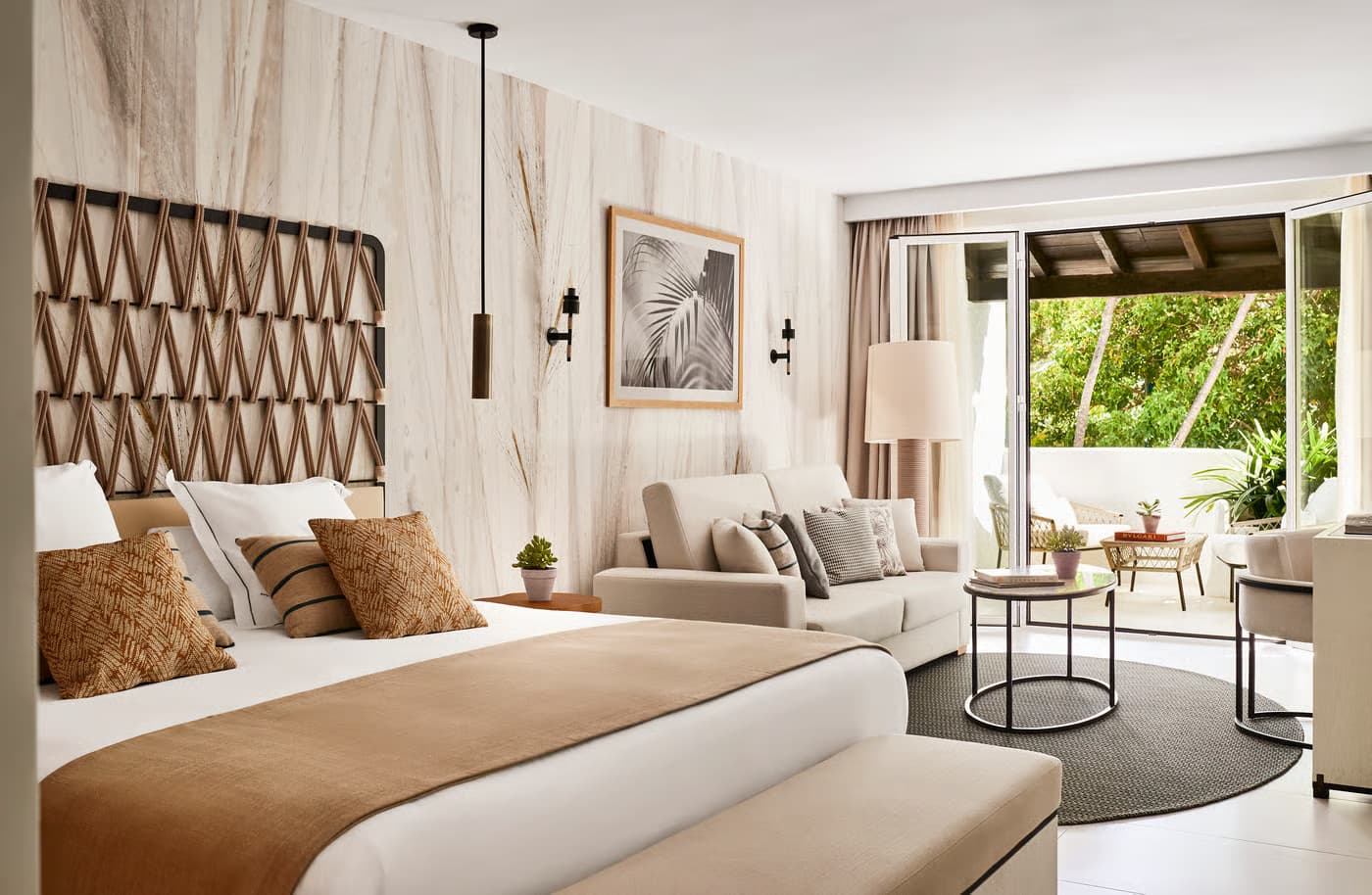 Double bed suite with a patio space at Puente Romano Beach Resort
