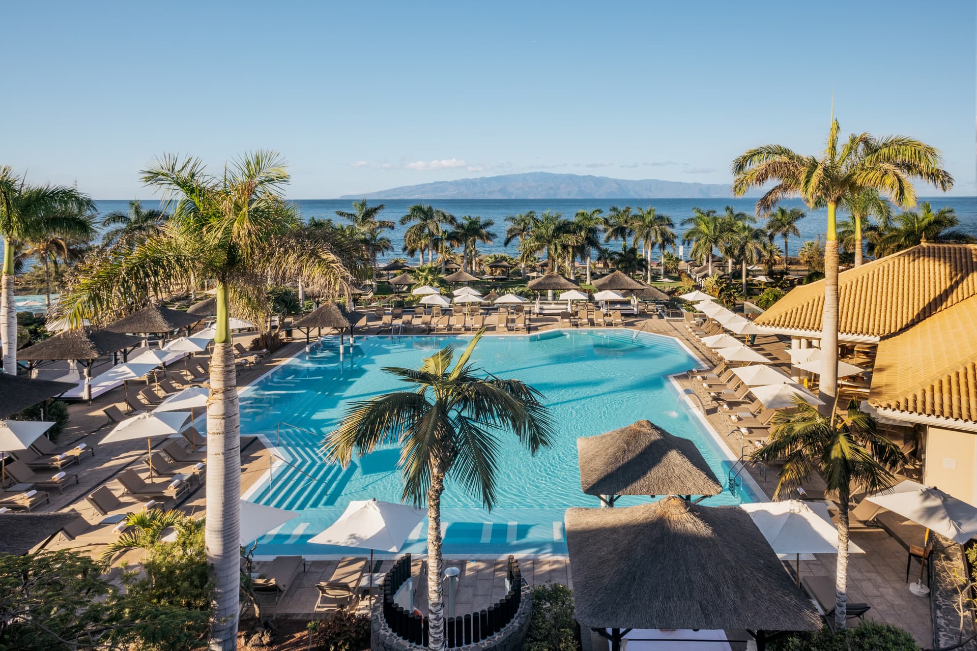 Overhead view of the outdoor swimming pool at RedLevel at Gran Meliá Palacio de Isora