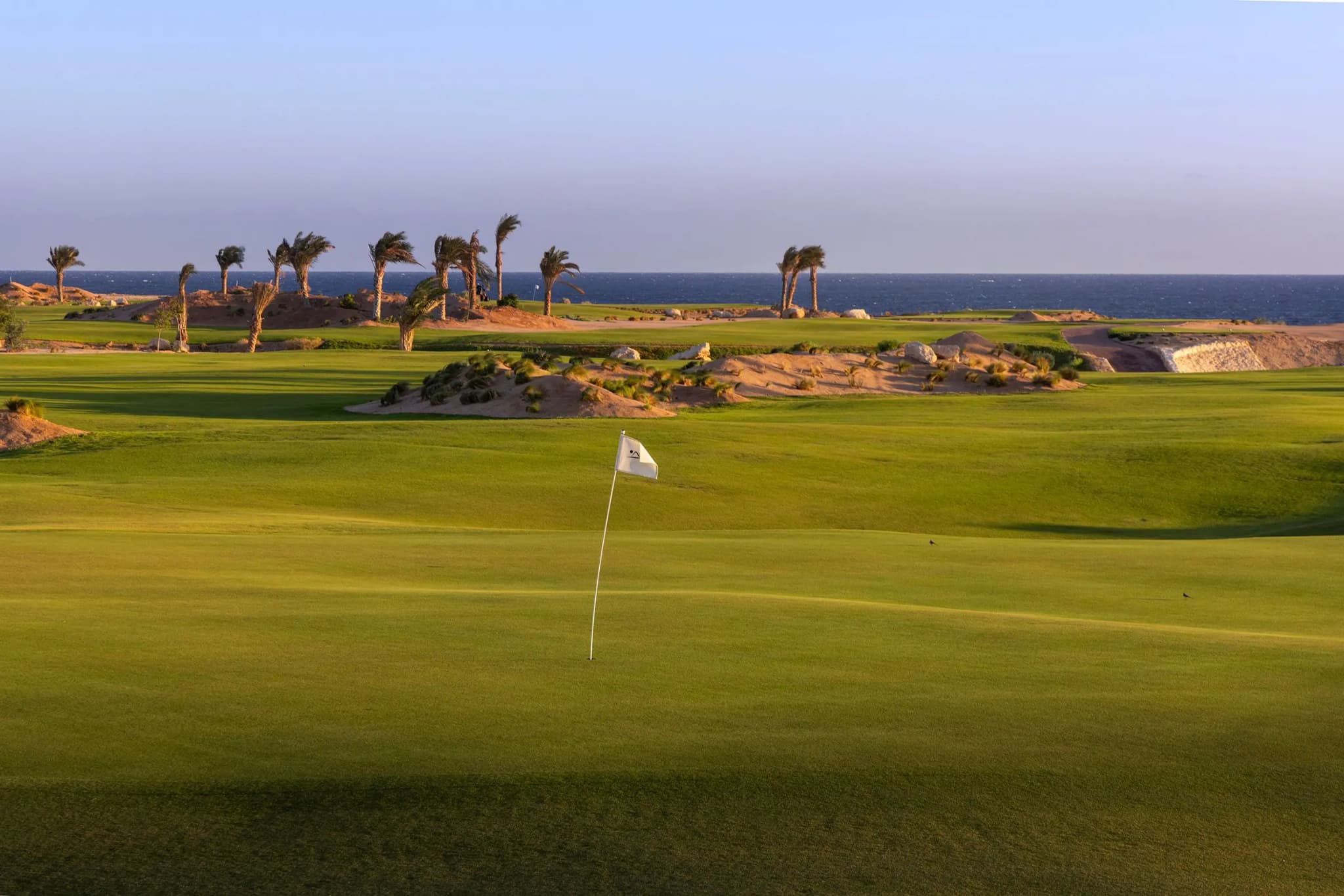 A well maintained fairway leading to a smooth green