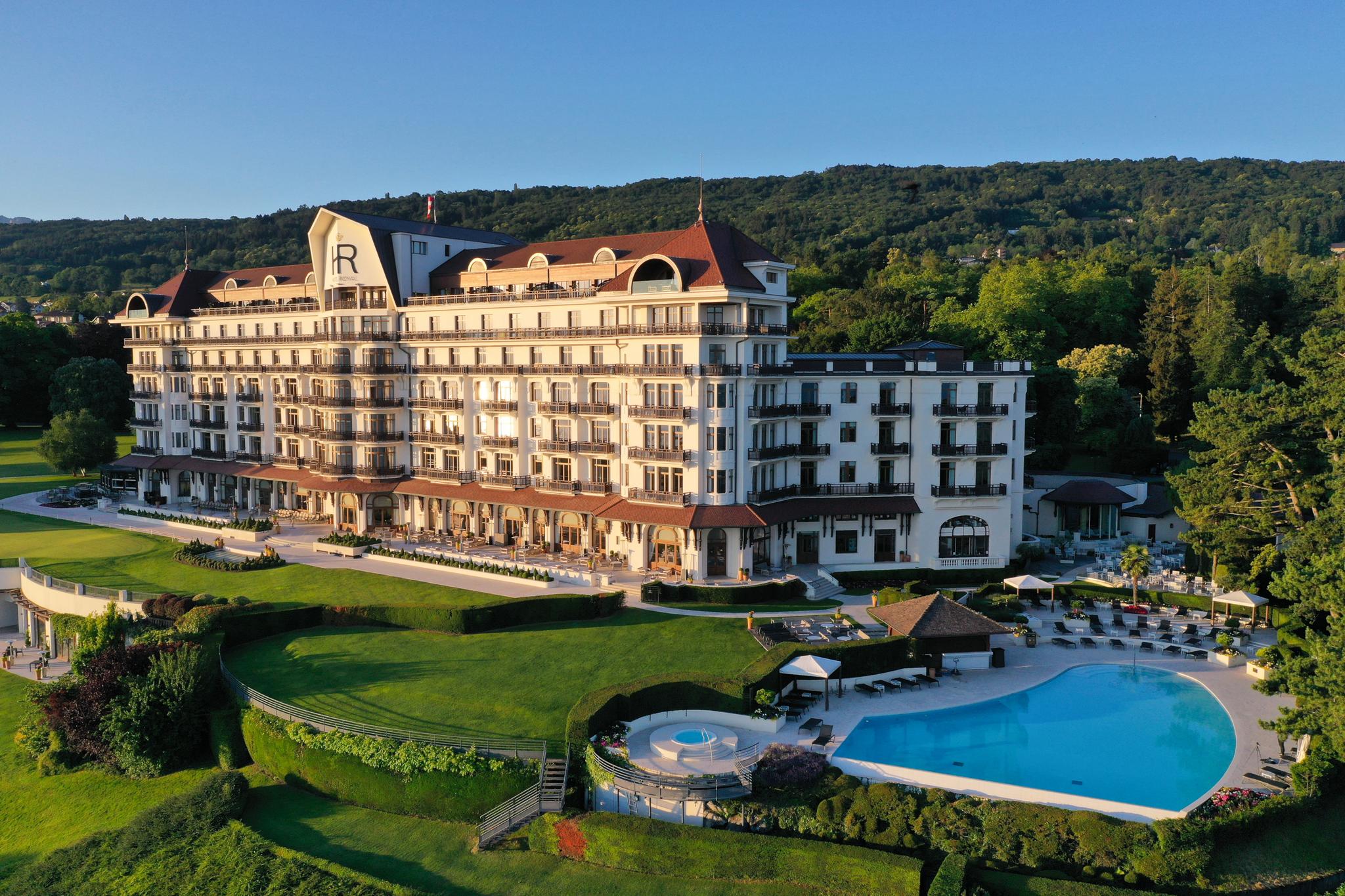 Panoramic view of Hotel Royal Evian Resort overlooking its outdoor pool