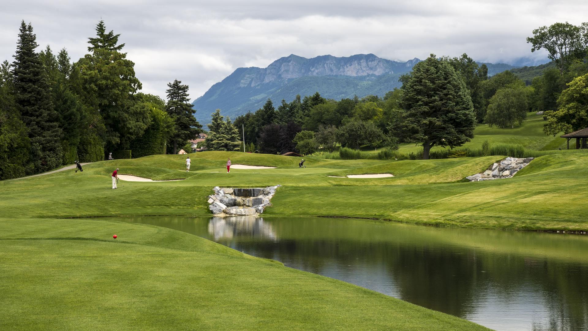A well maintained fairway nestled with sand bunkers