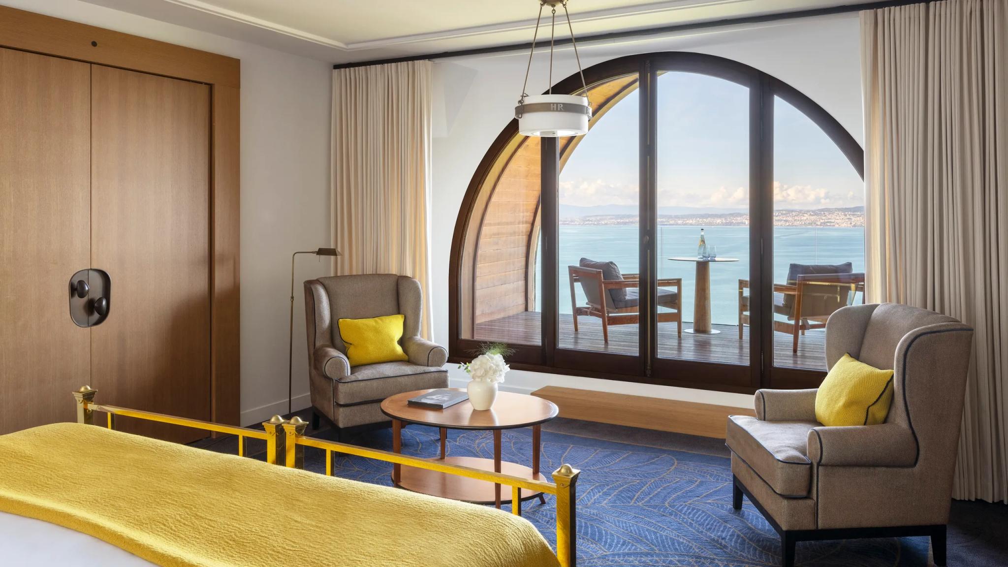 Double bed suite with balcony views at Hotel Royal Evian Resort