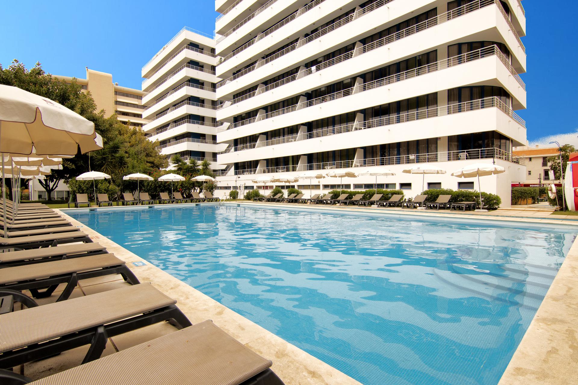 Outdoor swimming pool at Luna Olympus Hotel