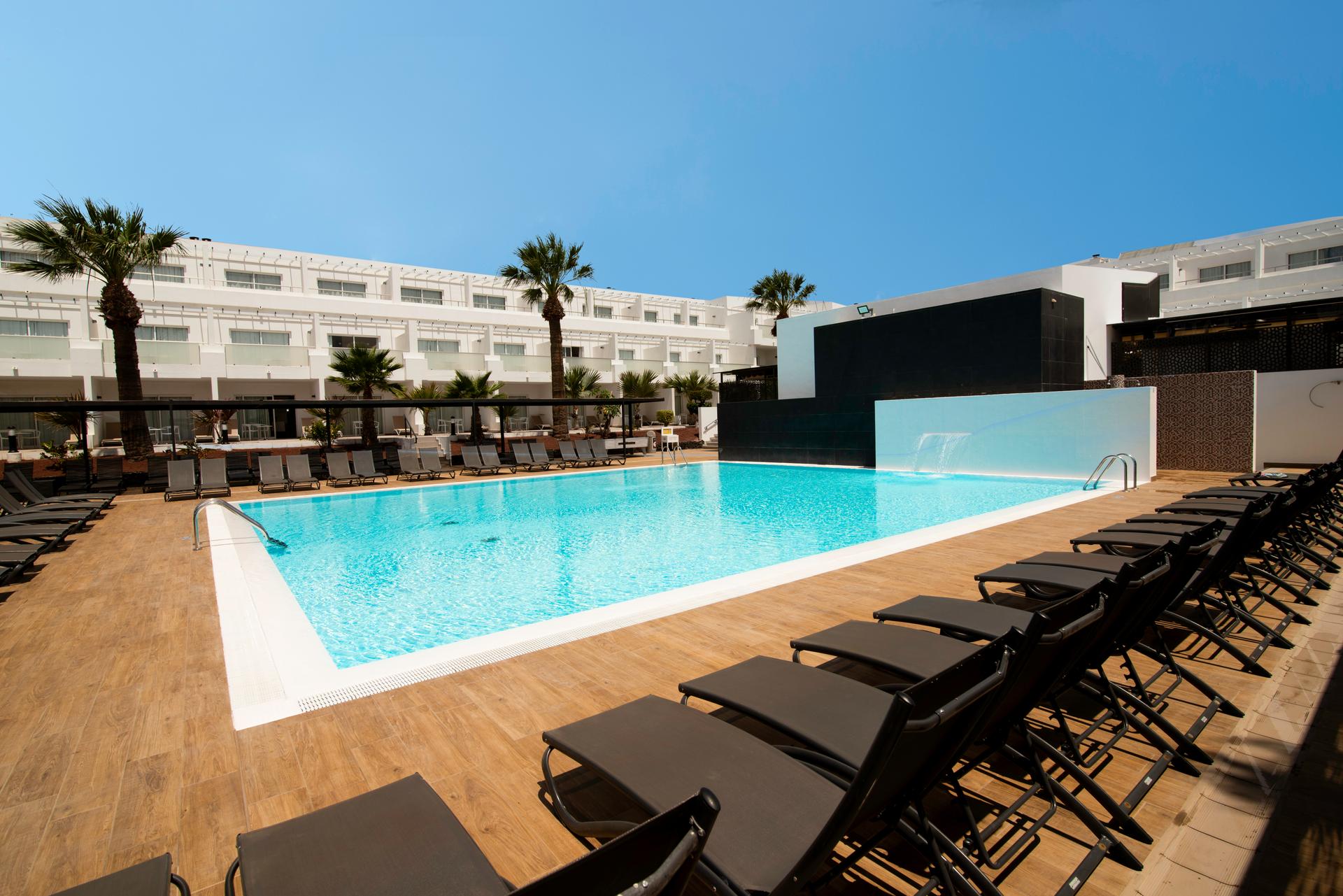 A large outdoor swimming pool at Aequora Lanzarote Suites