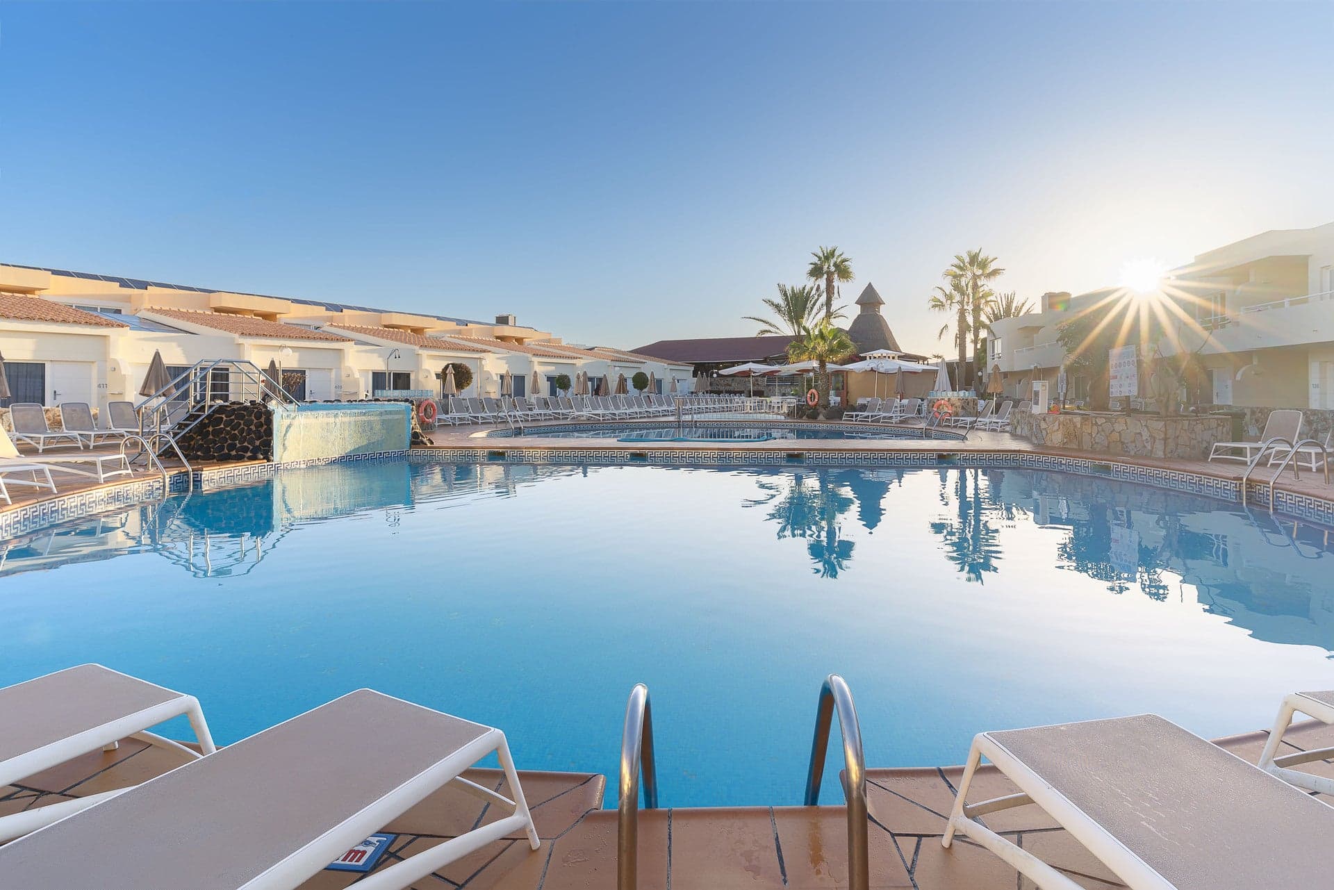 Outdoor swimming pool at Alexandre Teguise Playa