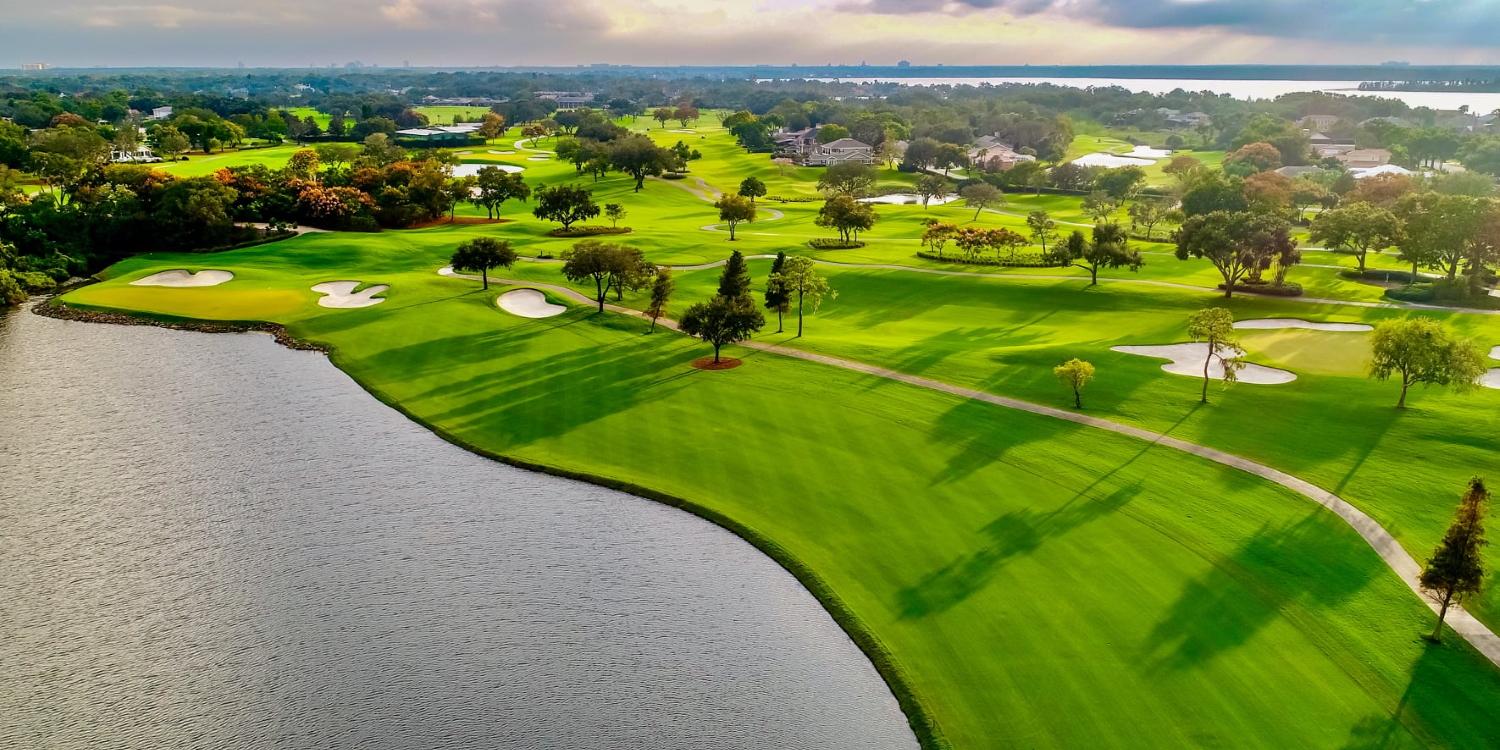 Overhead view of a well maintained fairway nestled with sand bunkers