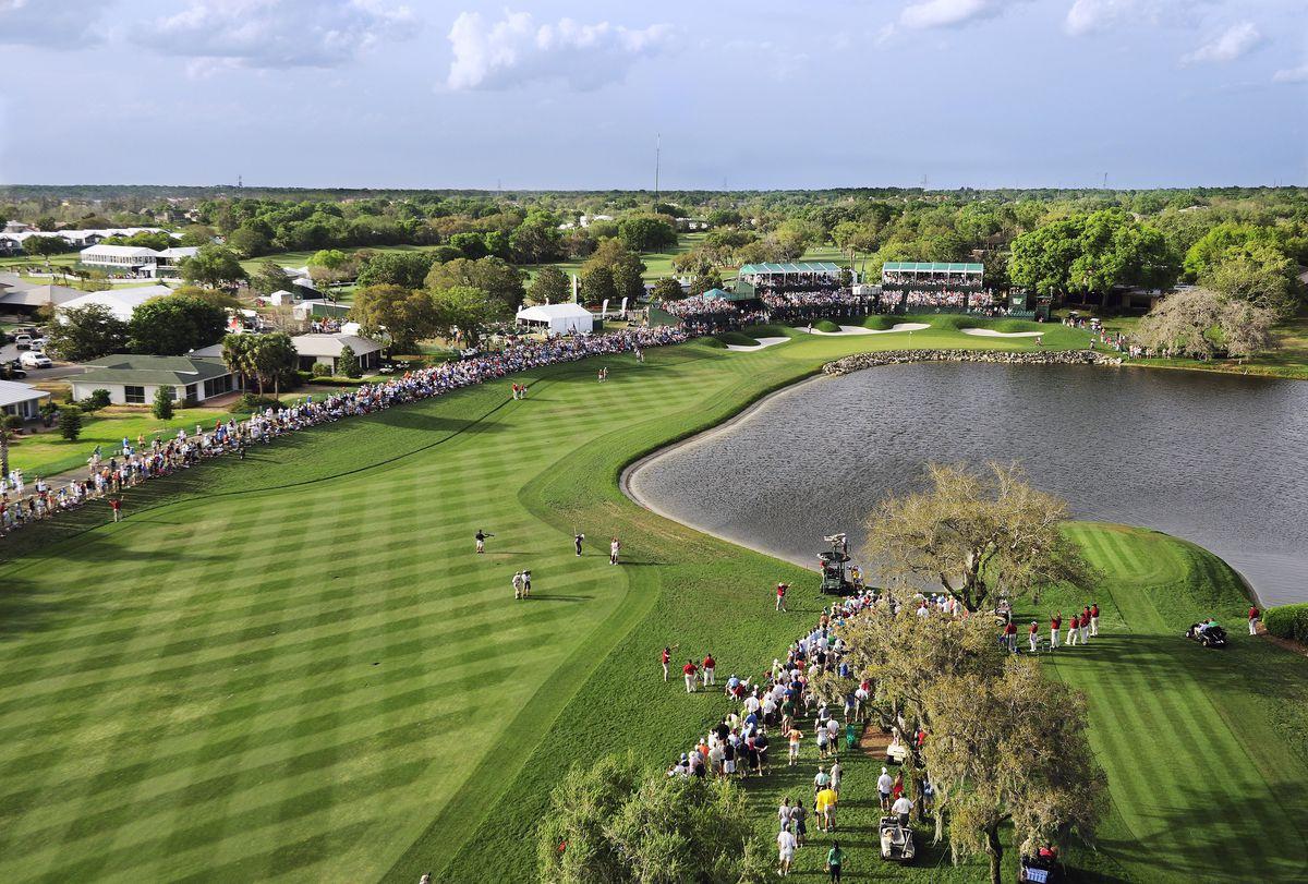 Overhead view of a well maintained fairway besides a water hazard