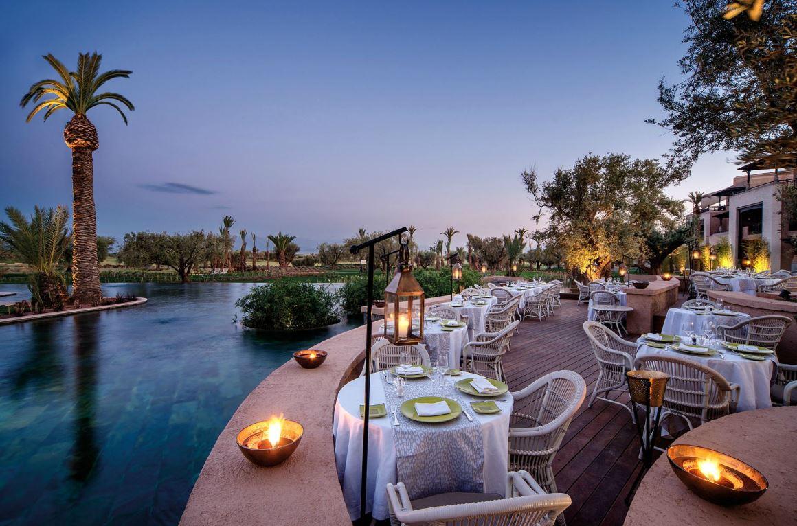 Panoramic view of poolside dining at Fairmont Royal Palm Marrakech