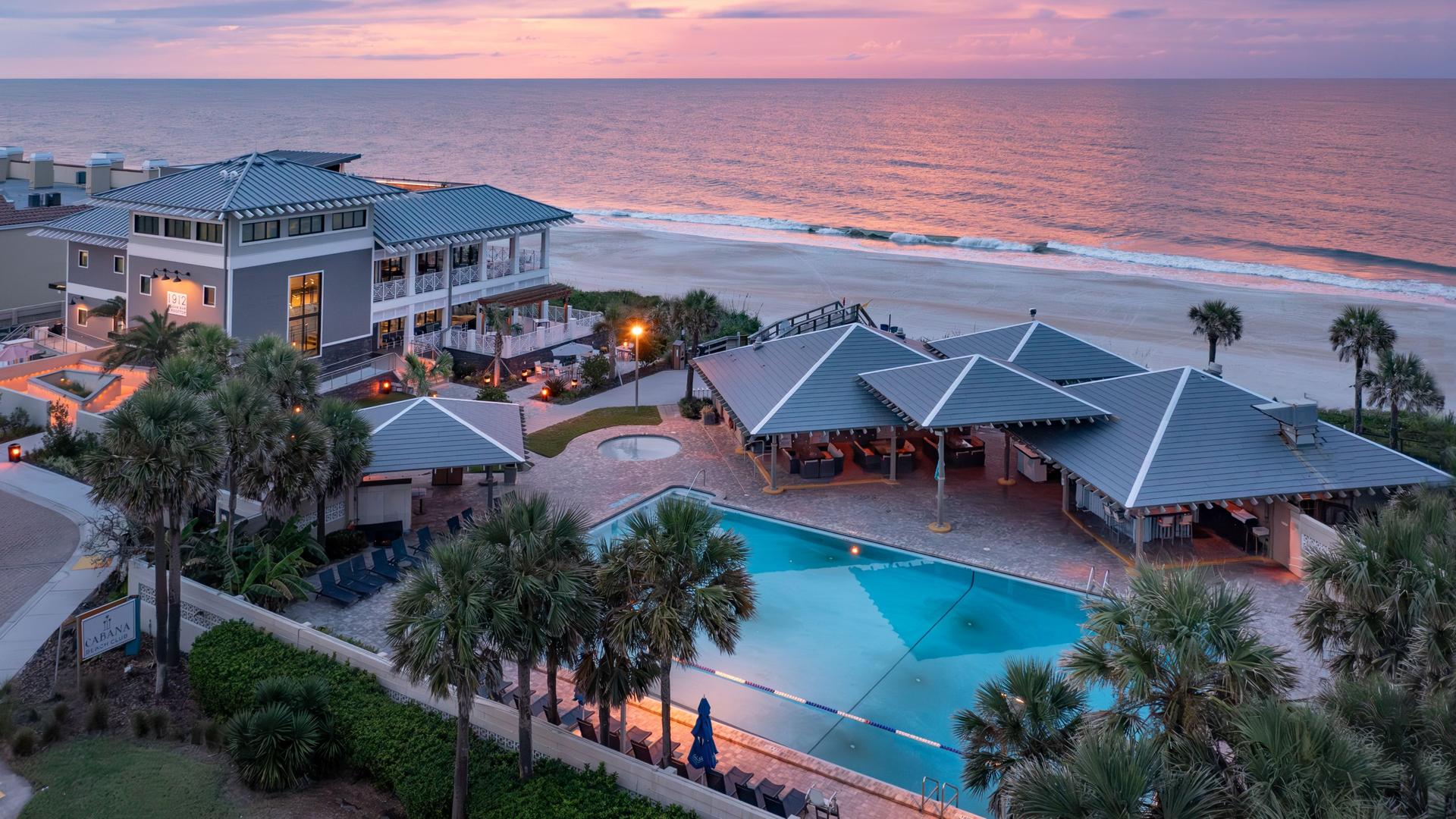 Overhead view of the outdoor swimming pool leading to the beach at Sawgrass Marriott Golf Resort & Spa