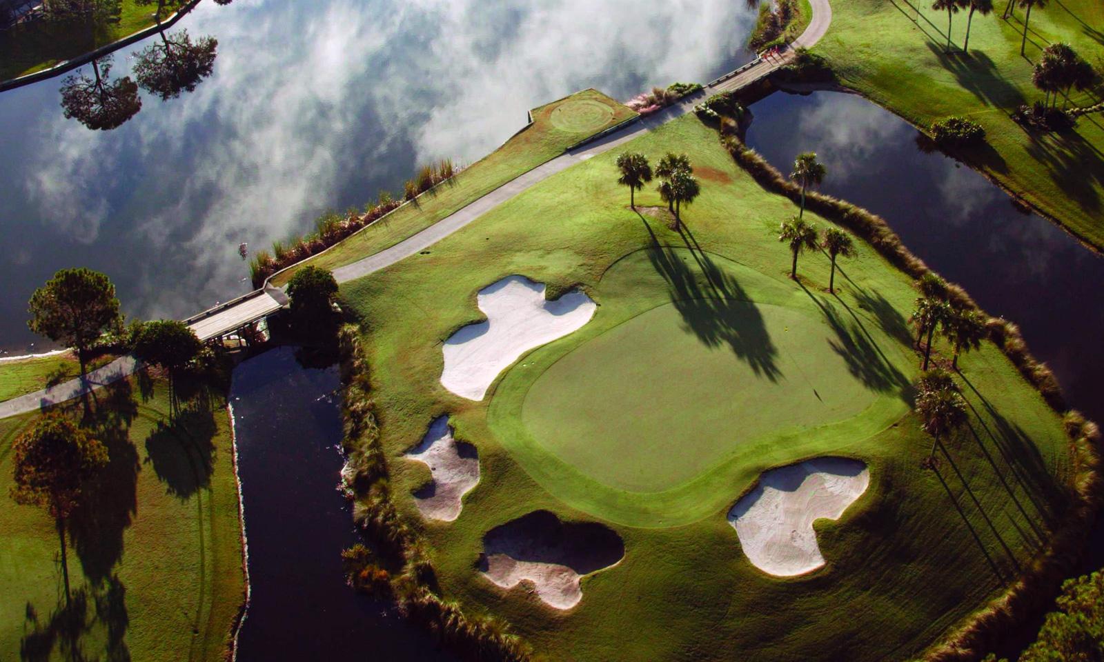 Overhead view of an island green surrounded by sand bunkers