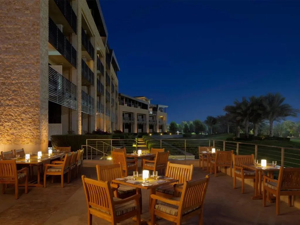 Outdoor dining area at the VOGO Abu Dhabi Golf Resort & Spa