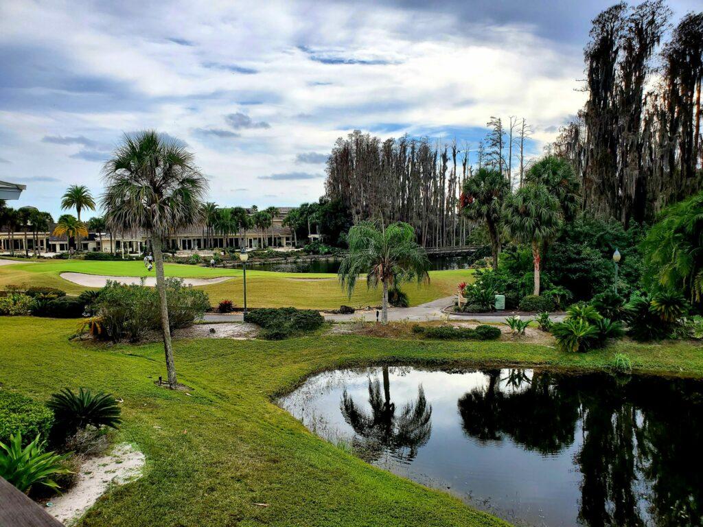 Panoramic view of a well maintained fairway next to a water hazard at Saddlebrook Resort