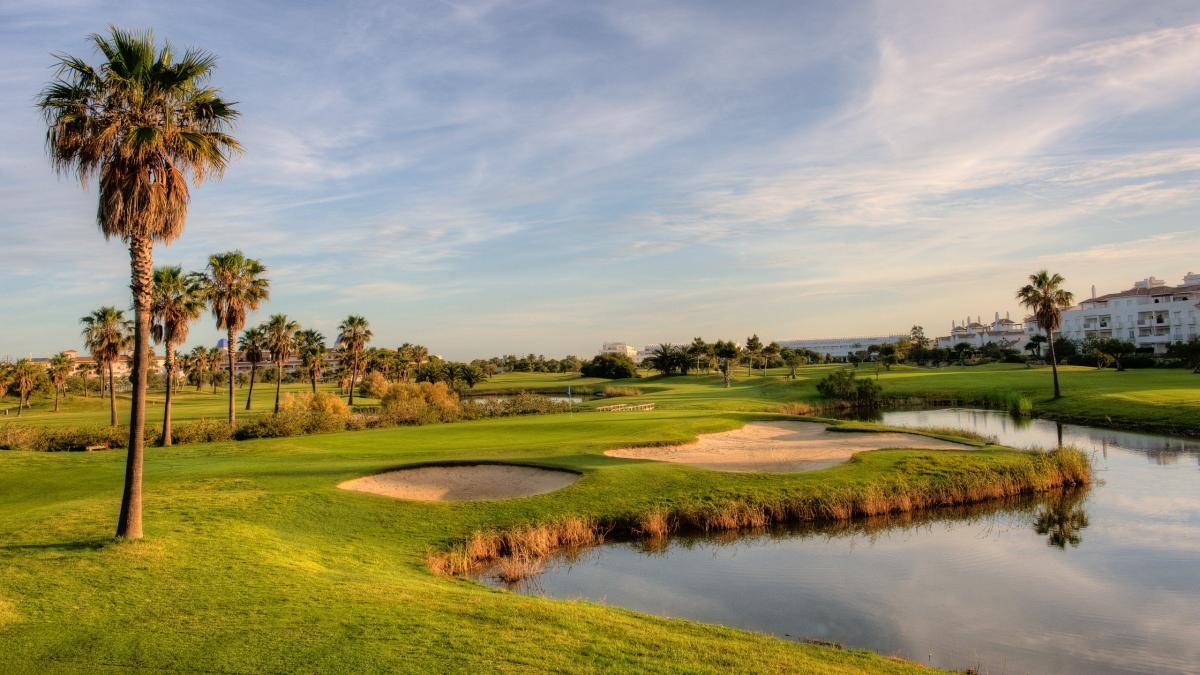 A well maintained fairway nestled with sand bunkers at Barcelo Costa Ballena Golf & Spa