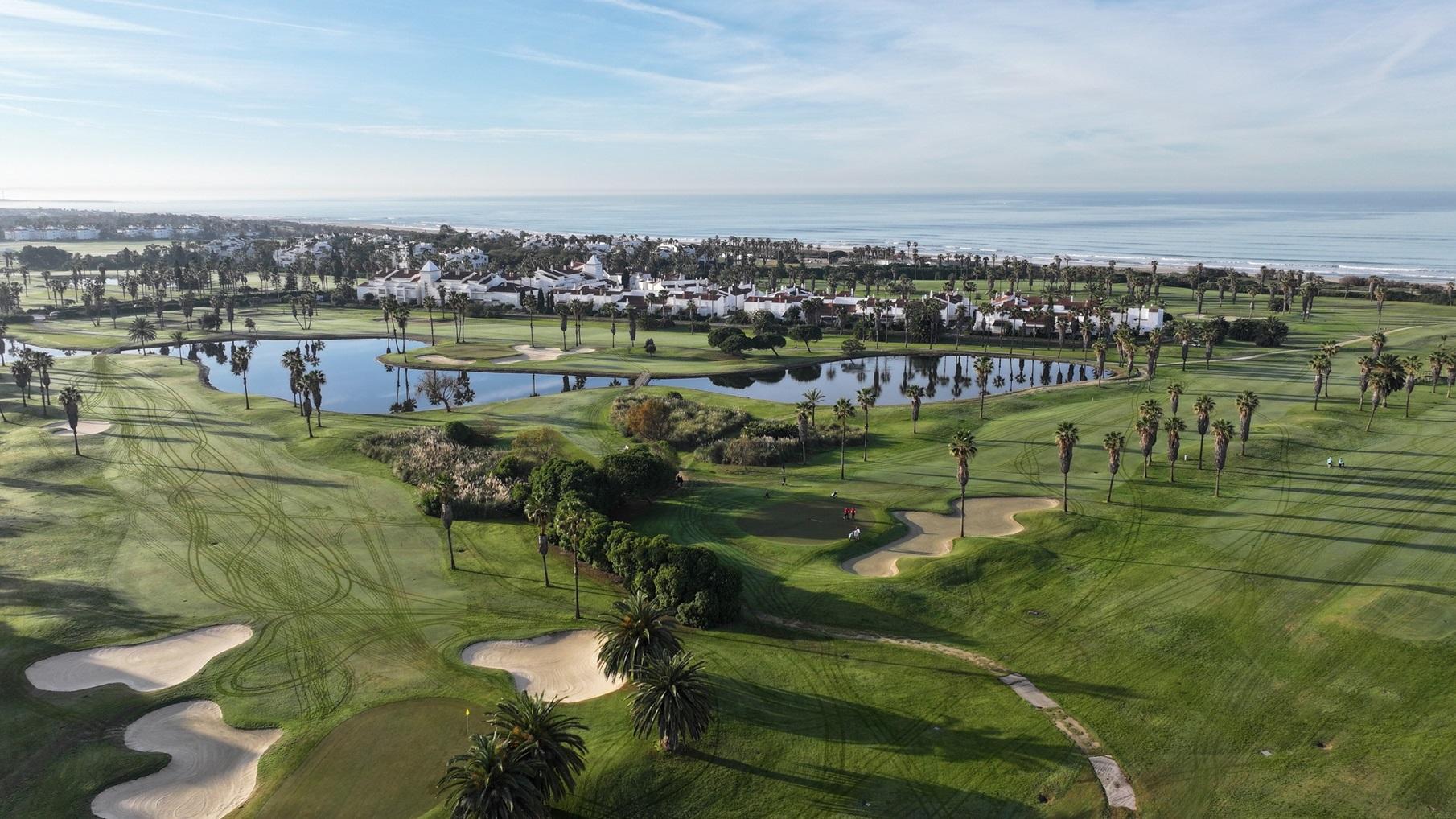 Overhead view of a well maintained fairway nestled with sand bunkers at the Barcelo Costa Ballena Golf & Spa