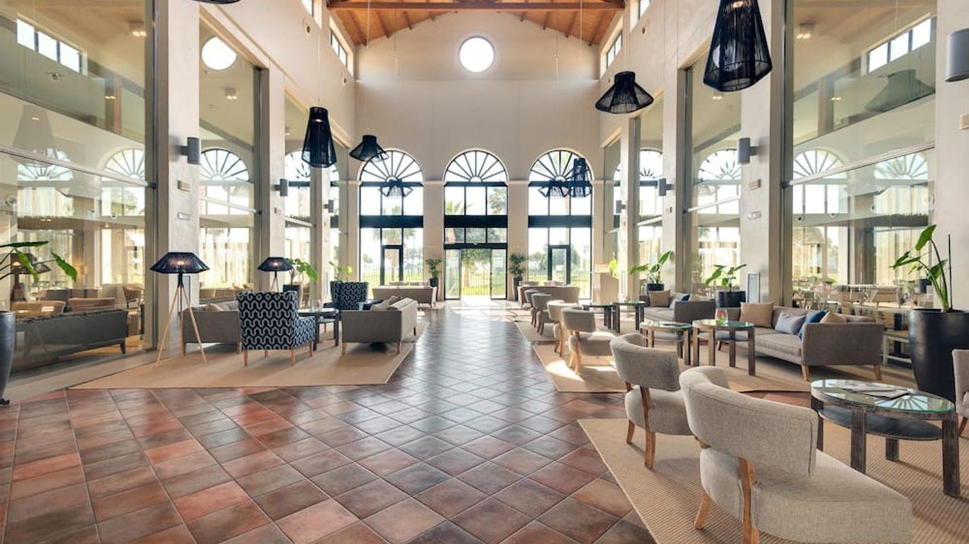 Indoor lounging reception area at Barcelo Costa Ballena Golf & Spa