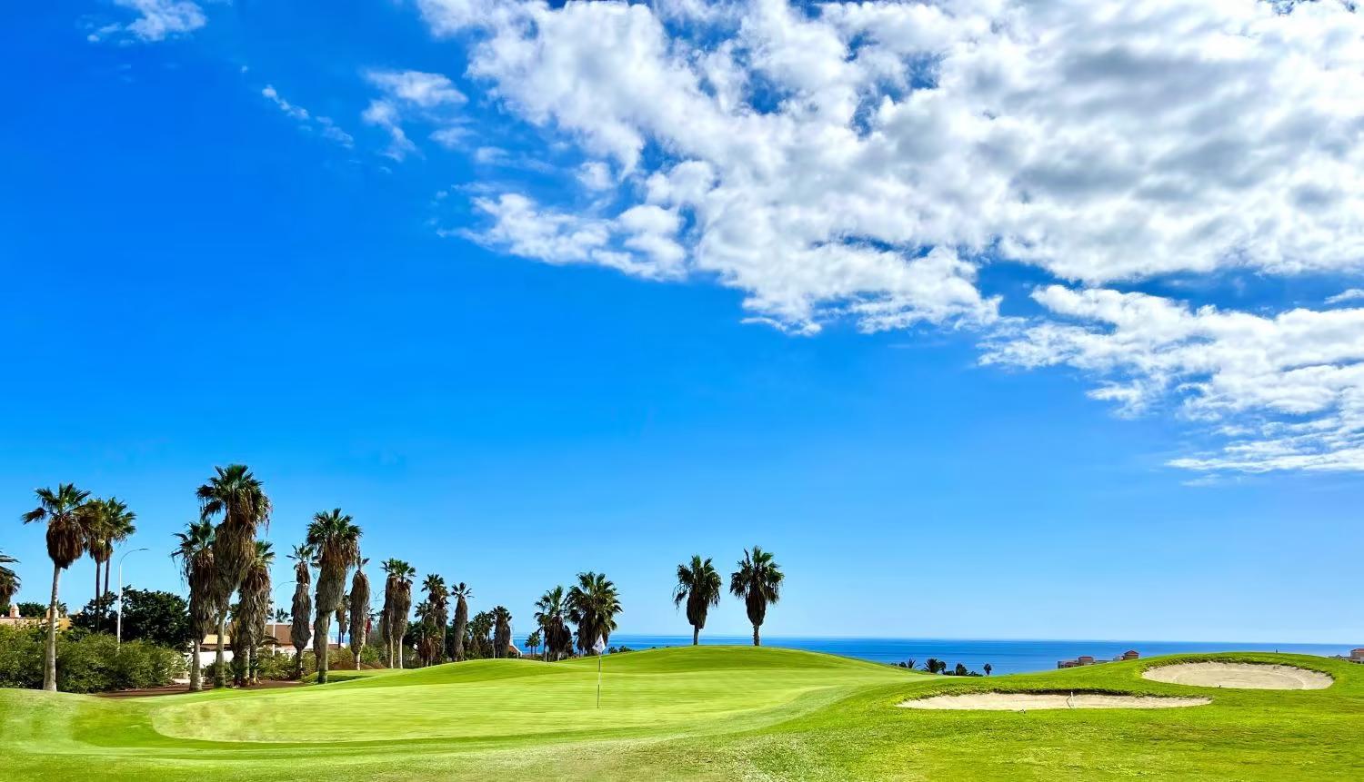 A well maintained fairway with coastal views