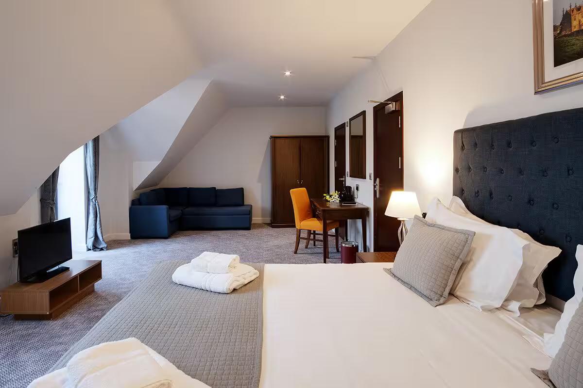 Spacious double bed suite at Cotswolds Golf Hotel and Spa