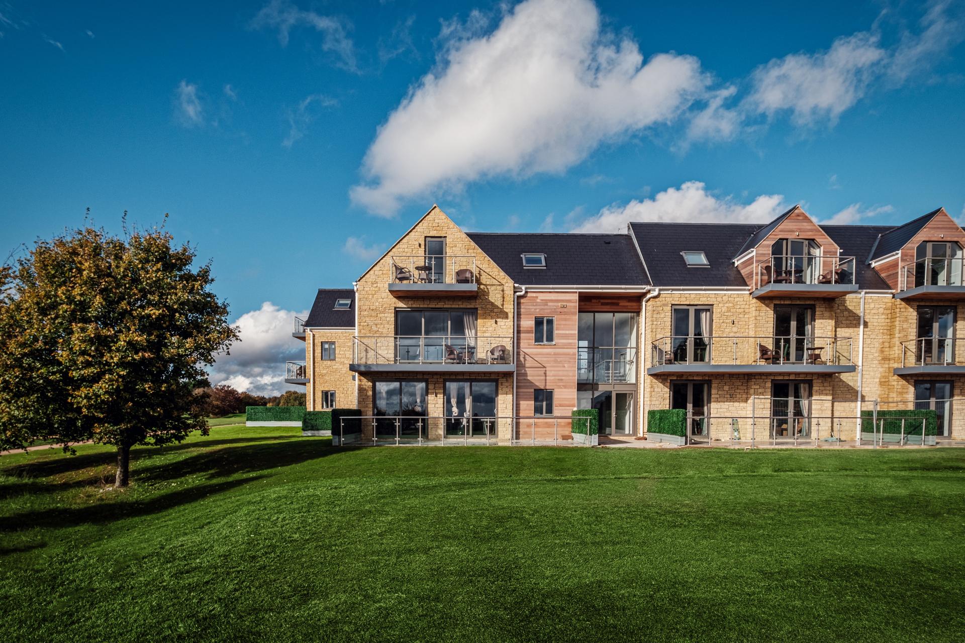 The Cotswolds Hotel, Spa & Golf Resort building overlooking the course
