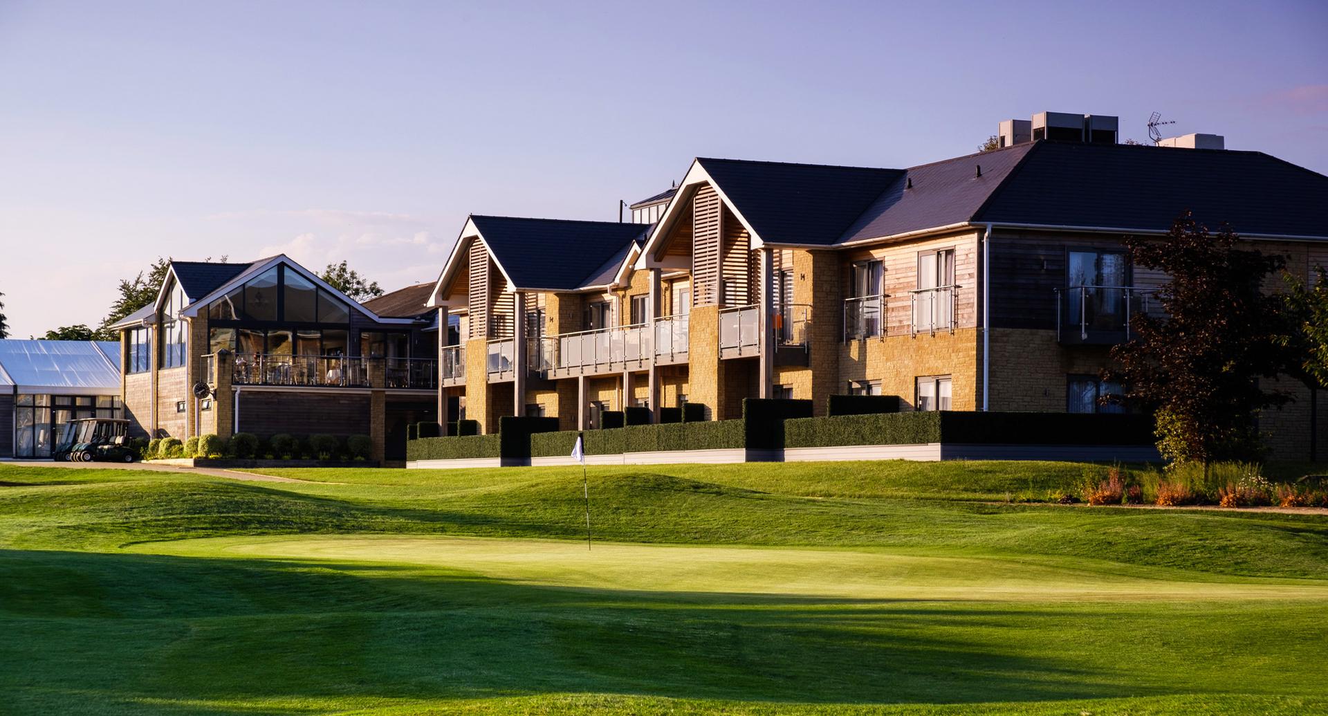 The Cotswolds Hotel, Spa & Golf Resort building overlooking the course