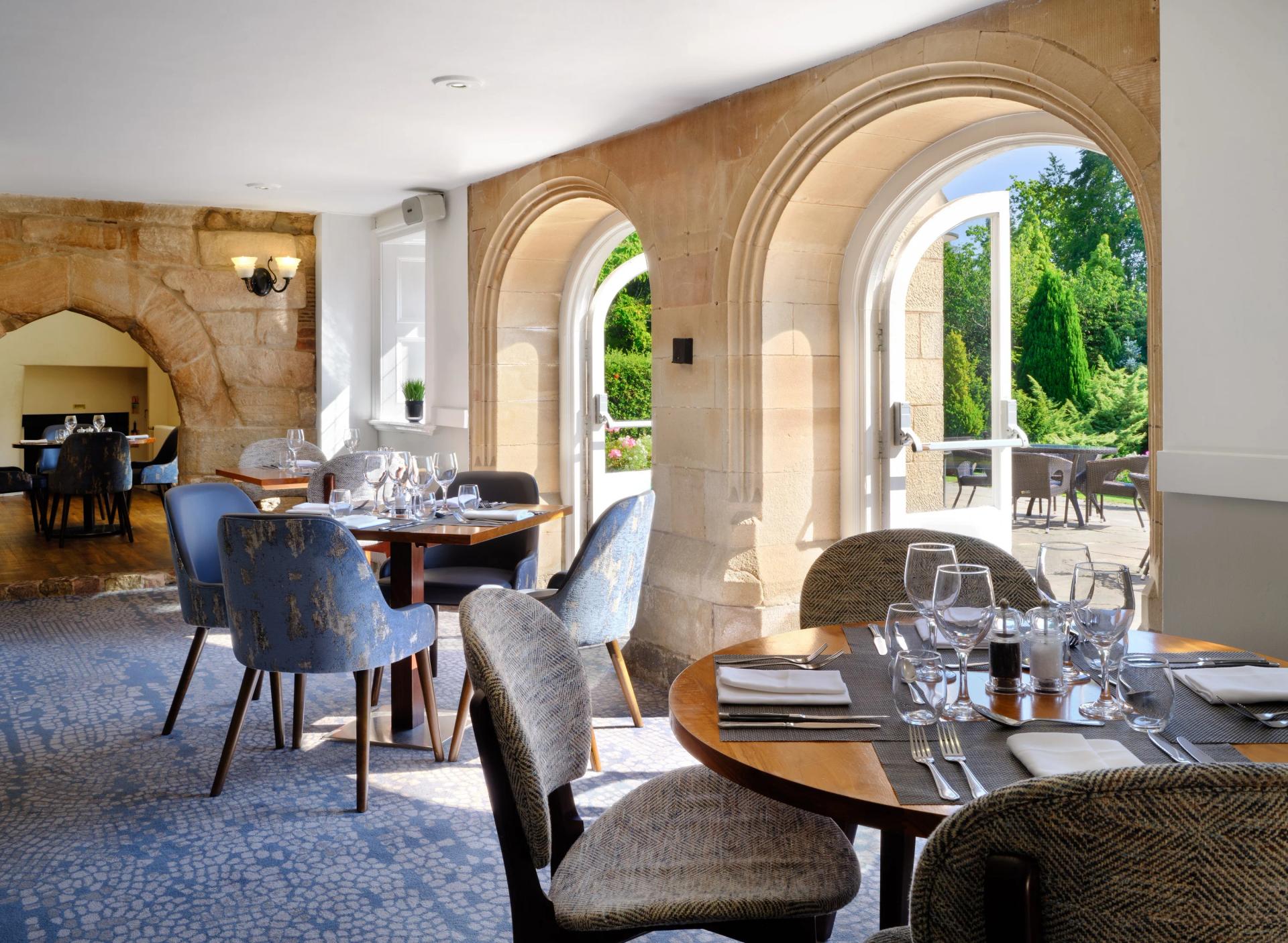 Outdoor dining area at the Delta Hotels by Marriott Breadsall Priory Country Club