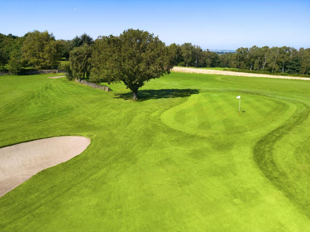Well maintained fairway nestled with a sand bunker