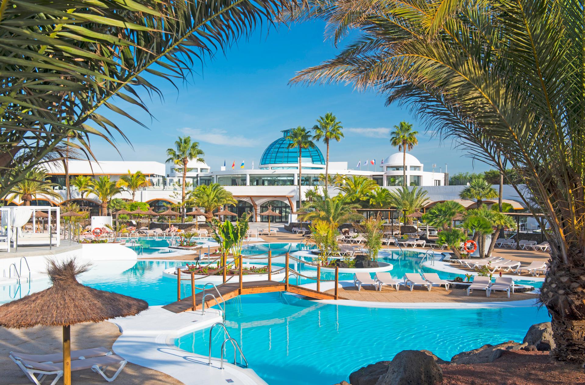 Panoramic view of the Elba Lanzarote Royal Village Resort overlooking the outdoor swimming pool