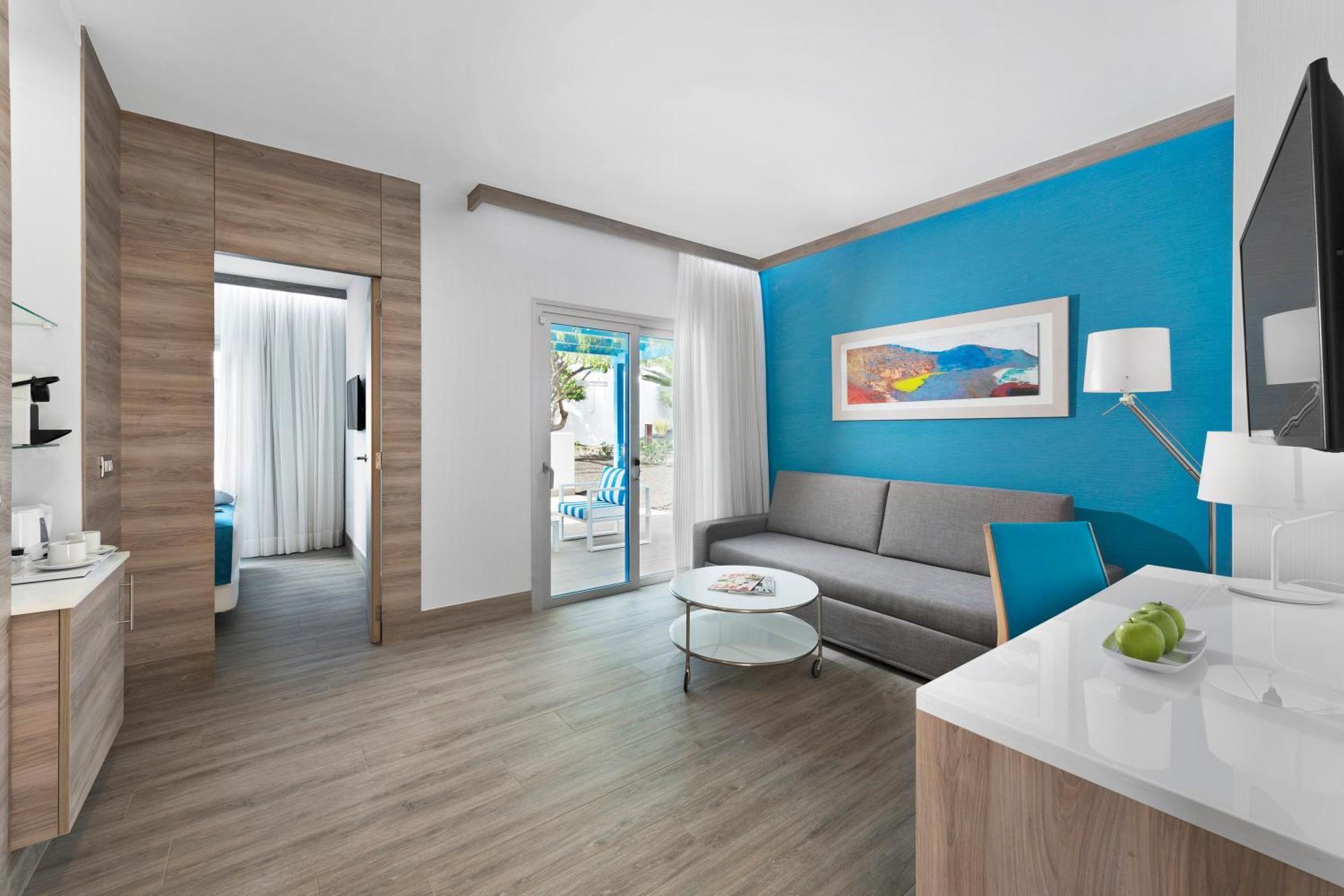 Living room as part of a double bed suite at Elba Lanzarote Royal Village Resort