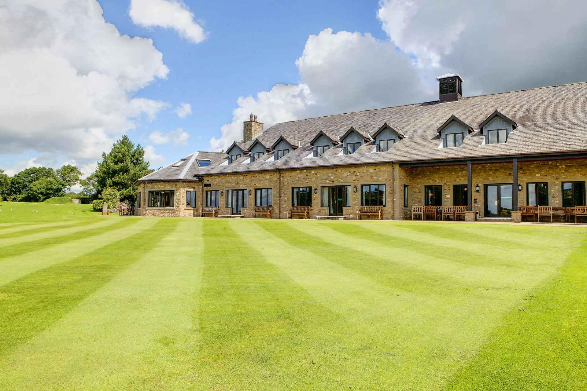 Panoramic view of the clubhouse overlooking the course