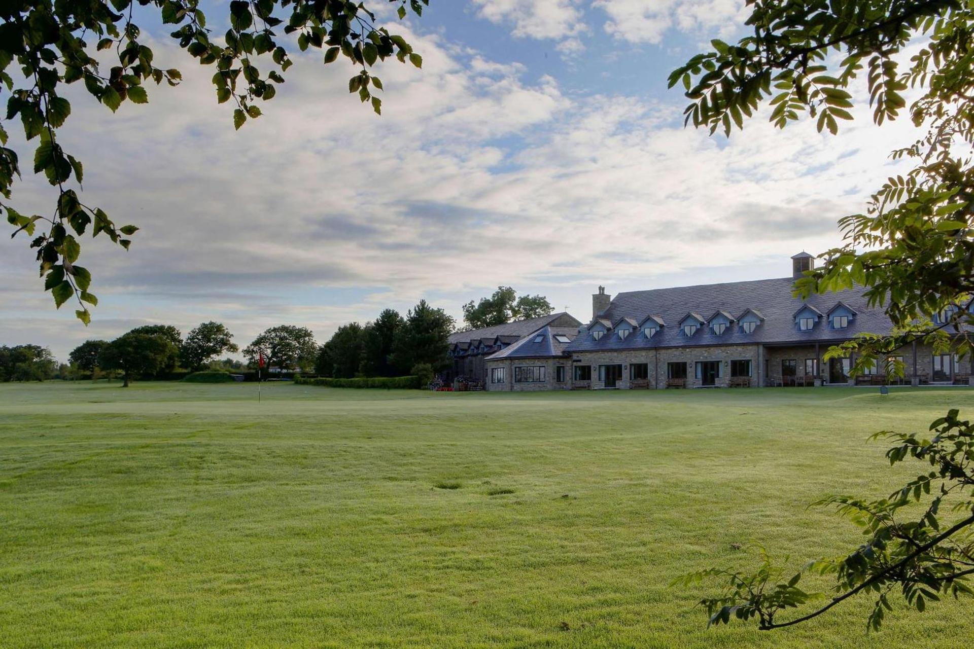 Panoramic view of the Garstang Hotel and Golf Clubhouse overlooking the course