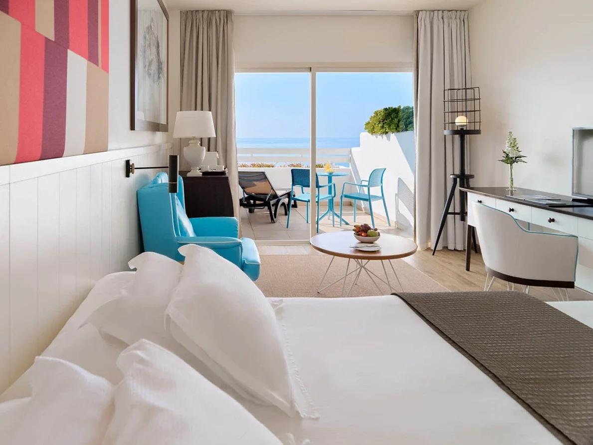 Double bed suite with balcony views at H10 Estepona Palace