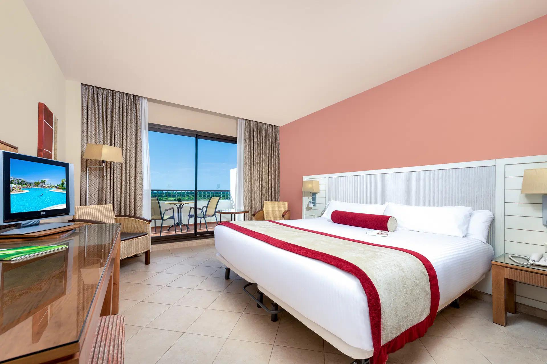 Double bed suite at Hotel Fuerte El Rompido with balcony views