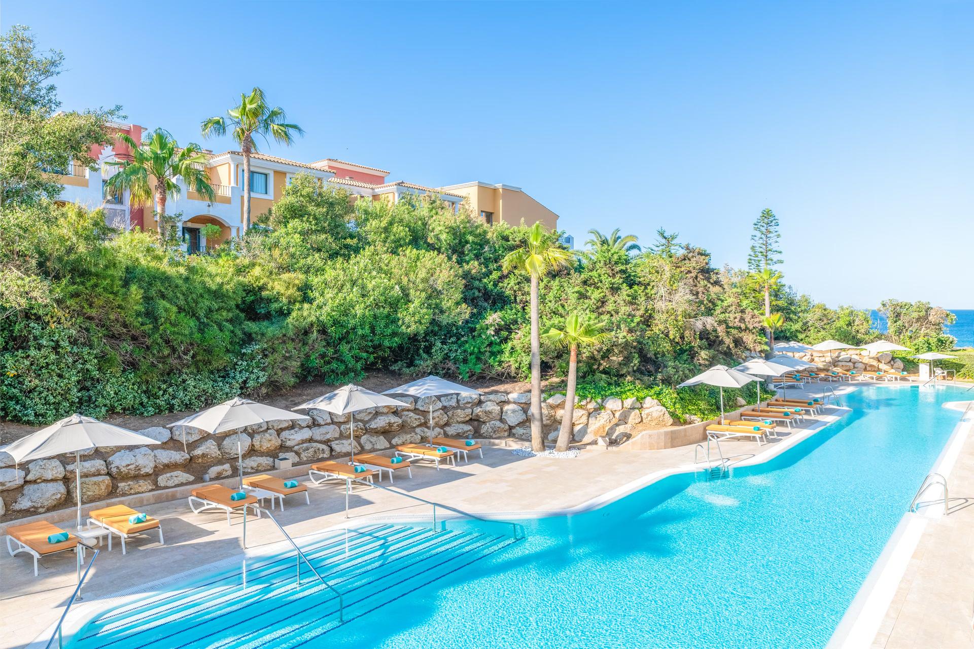 Outdoor lazy river style swimming pool at Iberostar Selection Andalucia Playa