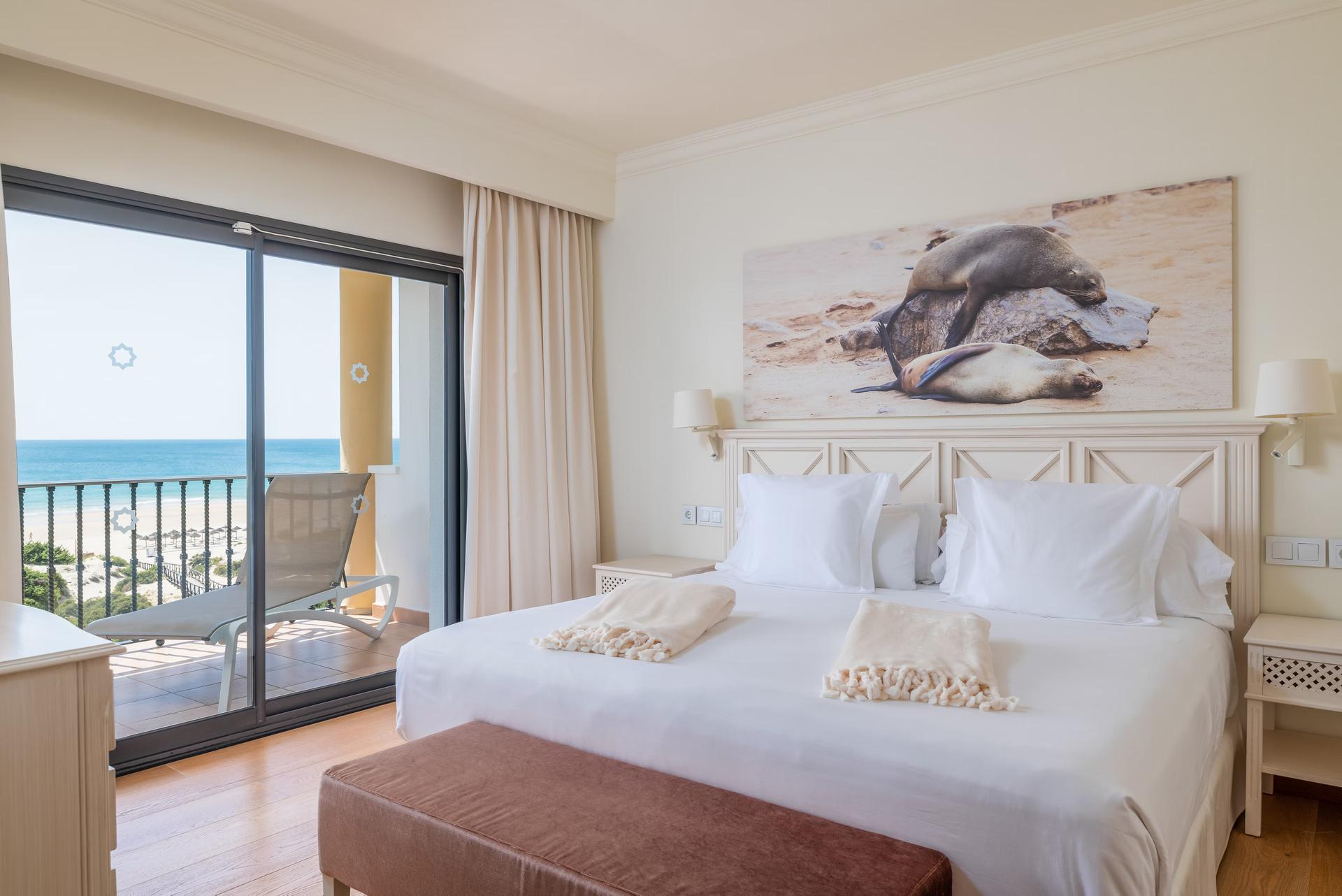 Double bed suite with balcony views of the beach at Iberostar Selection Andalucia Playa