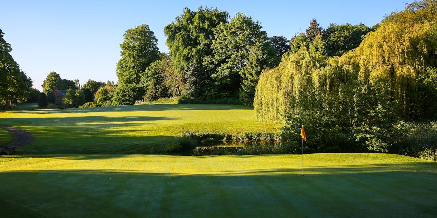 A wide fairway leading to a smooth green at the Macdonald Hill Valley Hotel, Golf & Spa