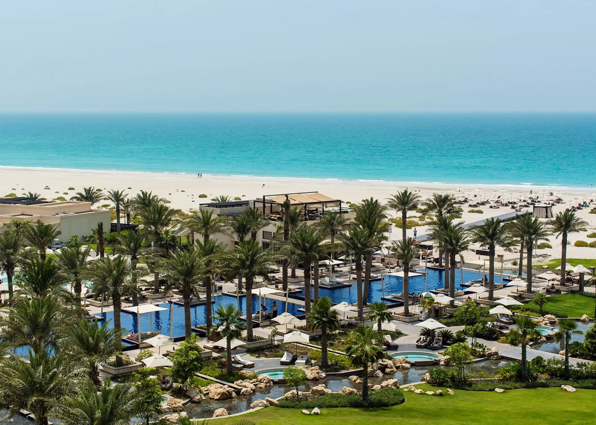 Overhead view of the outdoor swimming pool and private beach at the Park Hyatt Abu Dhabi Hotel and Villas