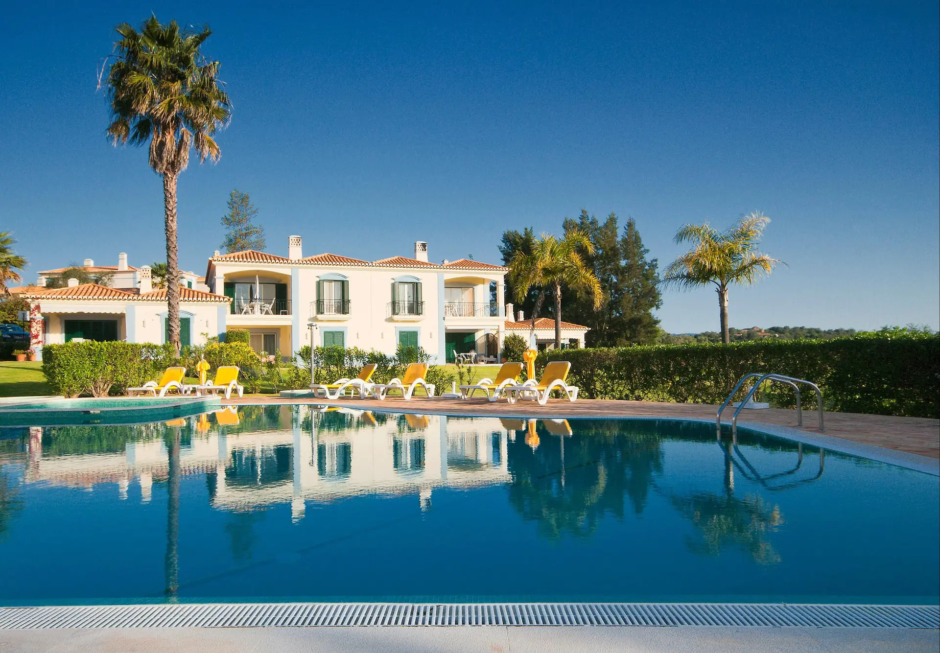 Panoramic view of a villa overlooking the outdoor swimming pool