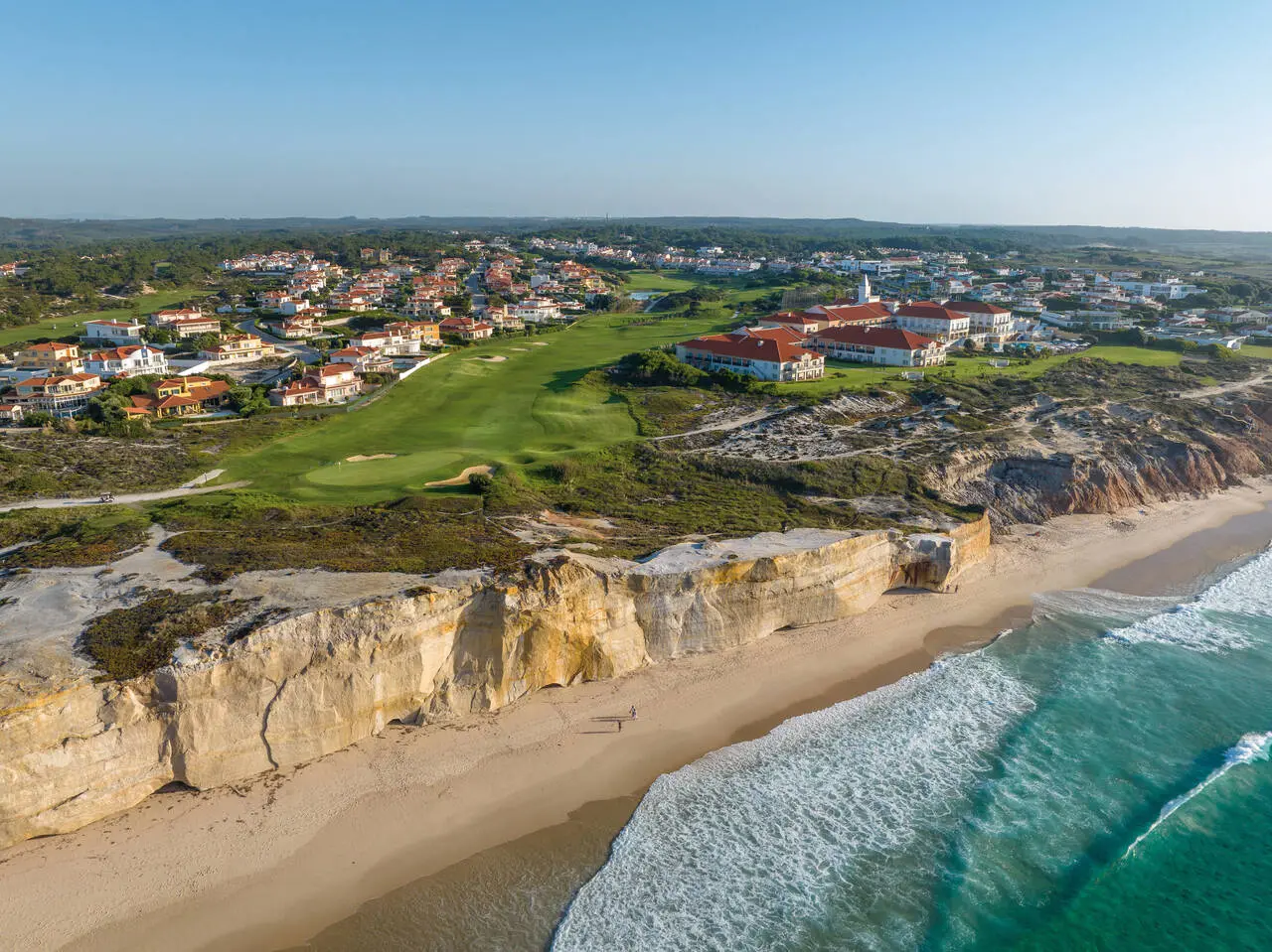 Overhead view of a well maintained fairway with coastal views