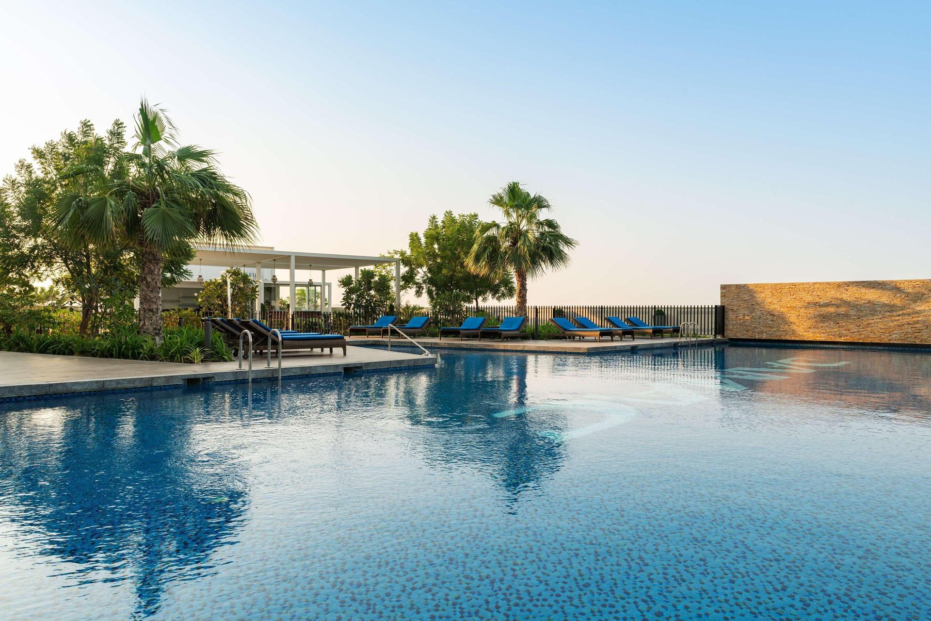 Outdoor swimming pool at the Radisson Dubai Damac Hills