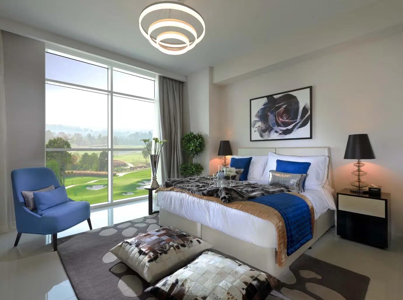 Double bed suite with views of the neighbouring golf course