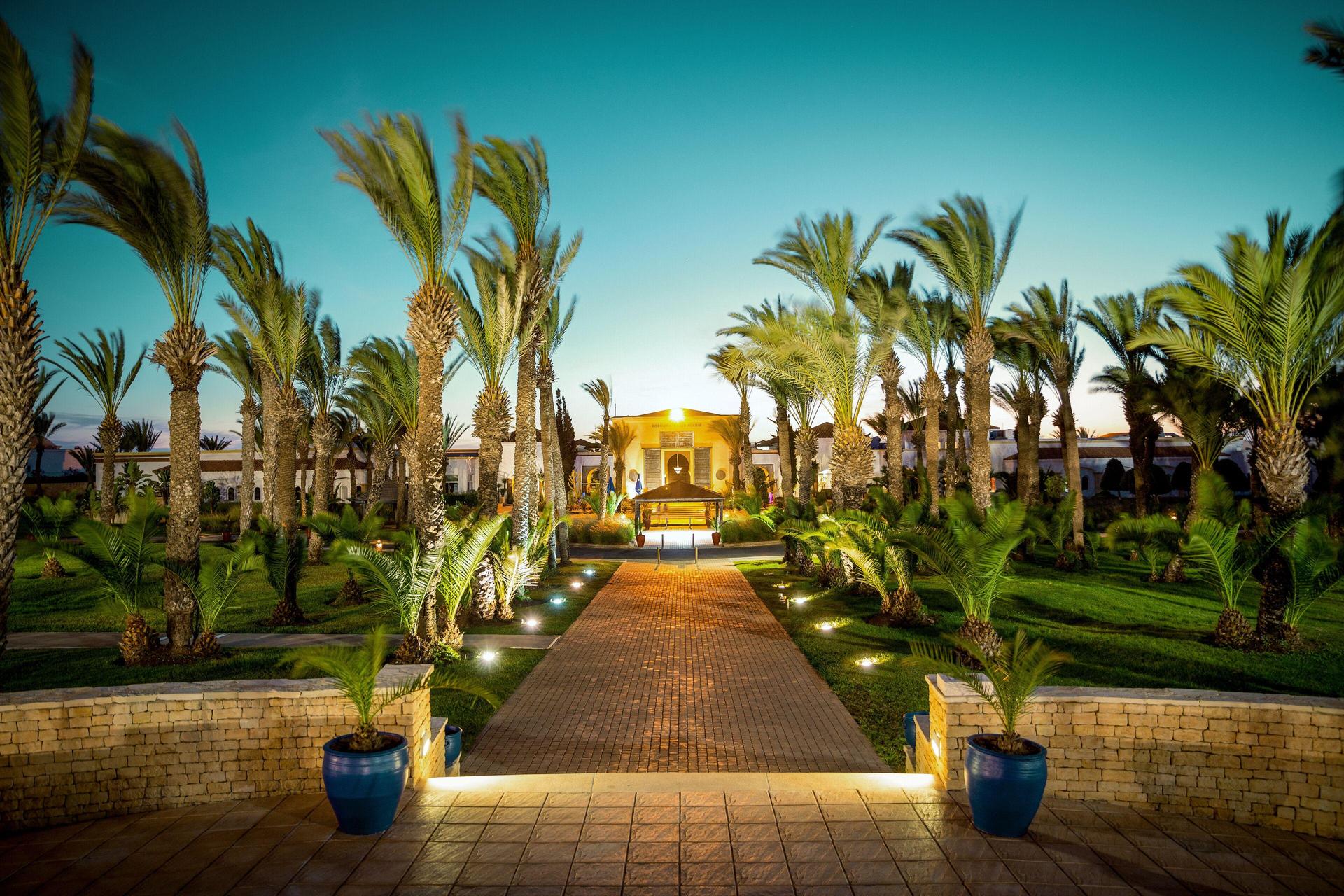Walkway towards the Robinson Agadir surrounded by a pal tree garden