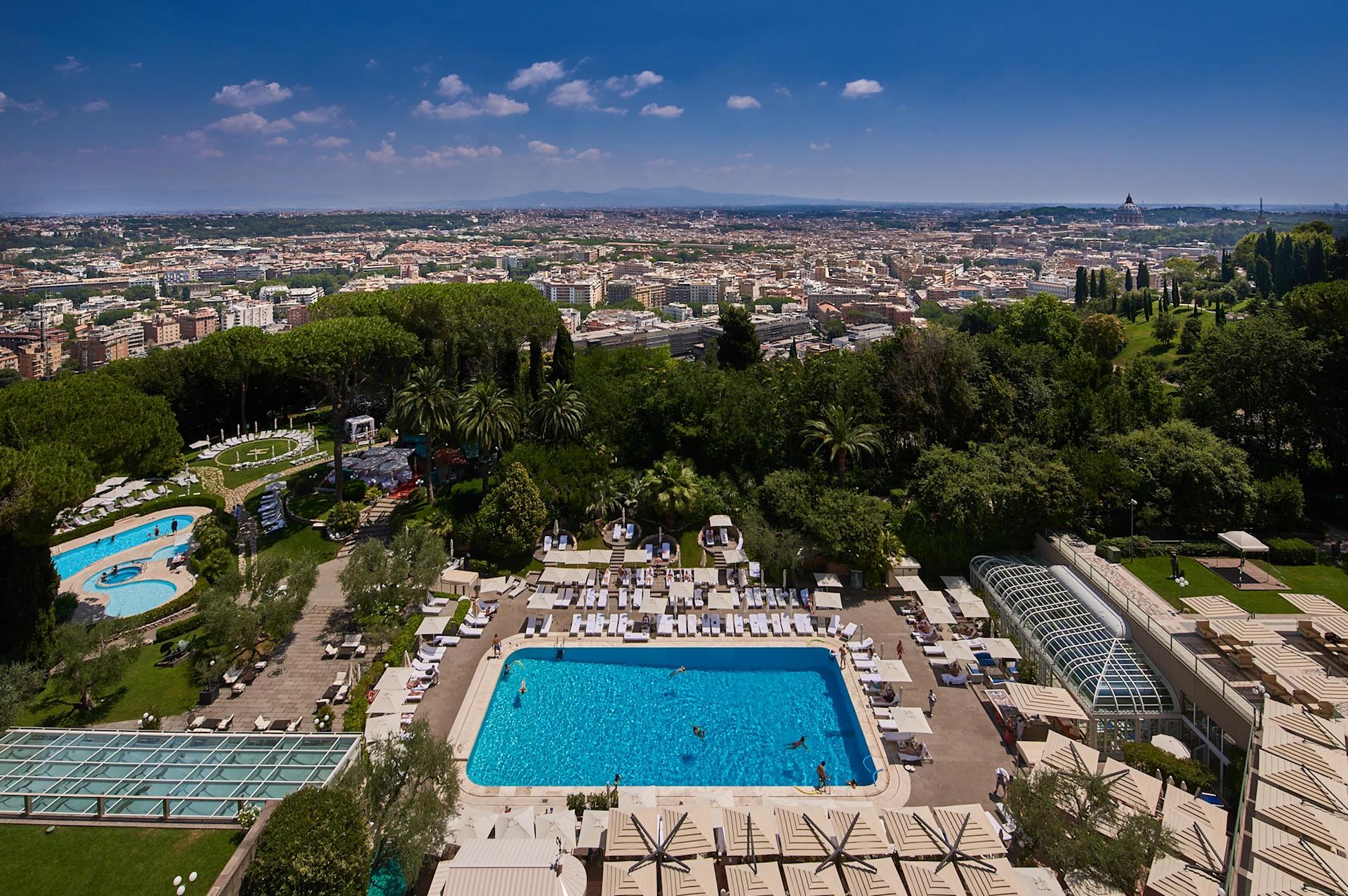 Overhead view of n outdoor swimming pool at Rome Cavalieri, A Waldorf Astoria Hotel