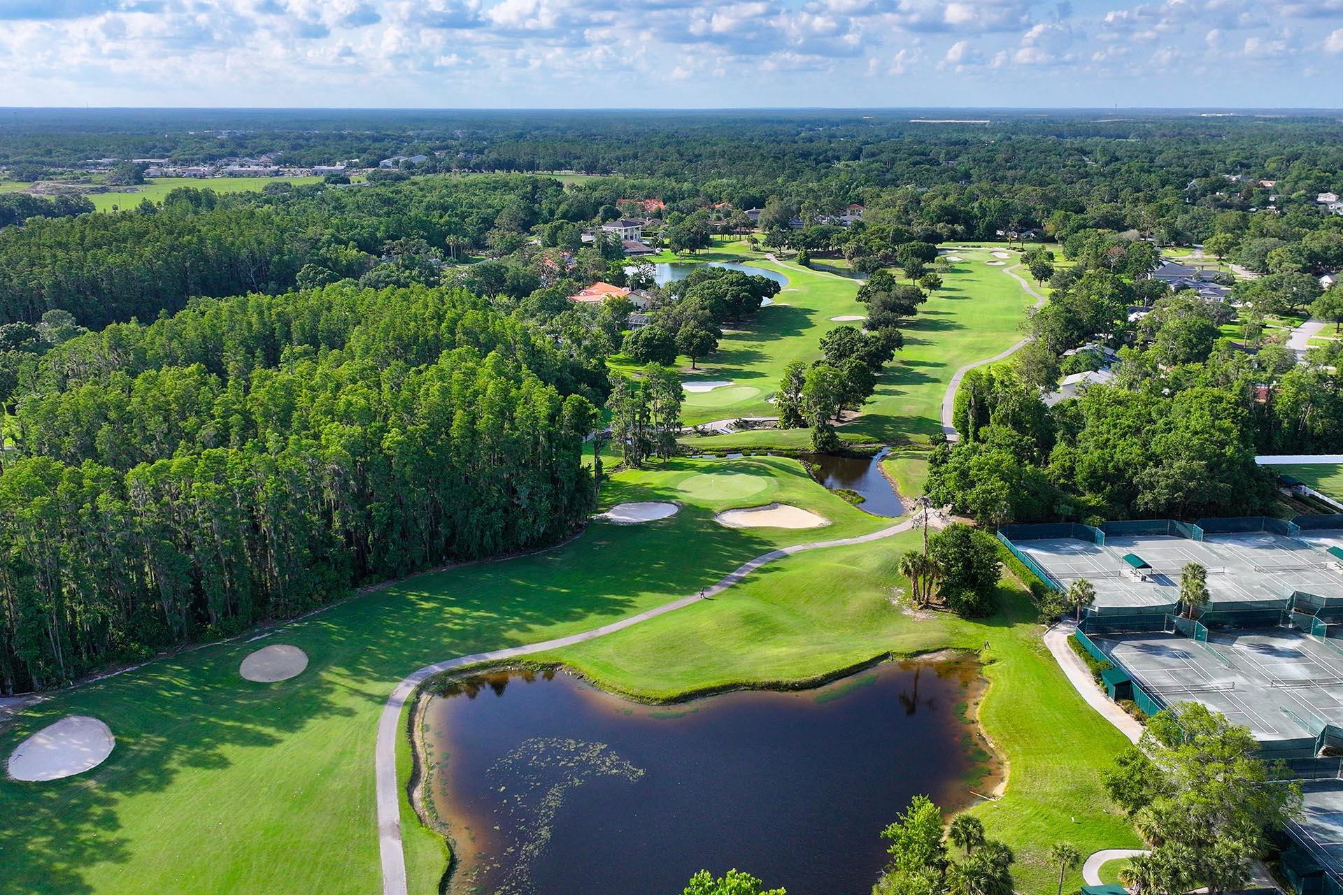 Overhead view of a well maintained fairway nestled with sand bunkers