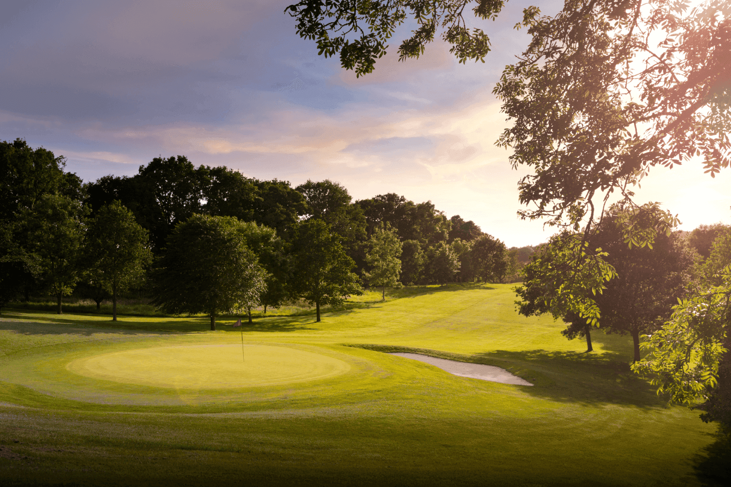 A well maintained fairway leading to a smooth green