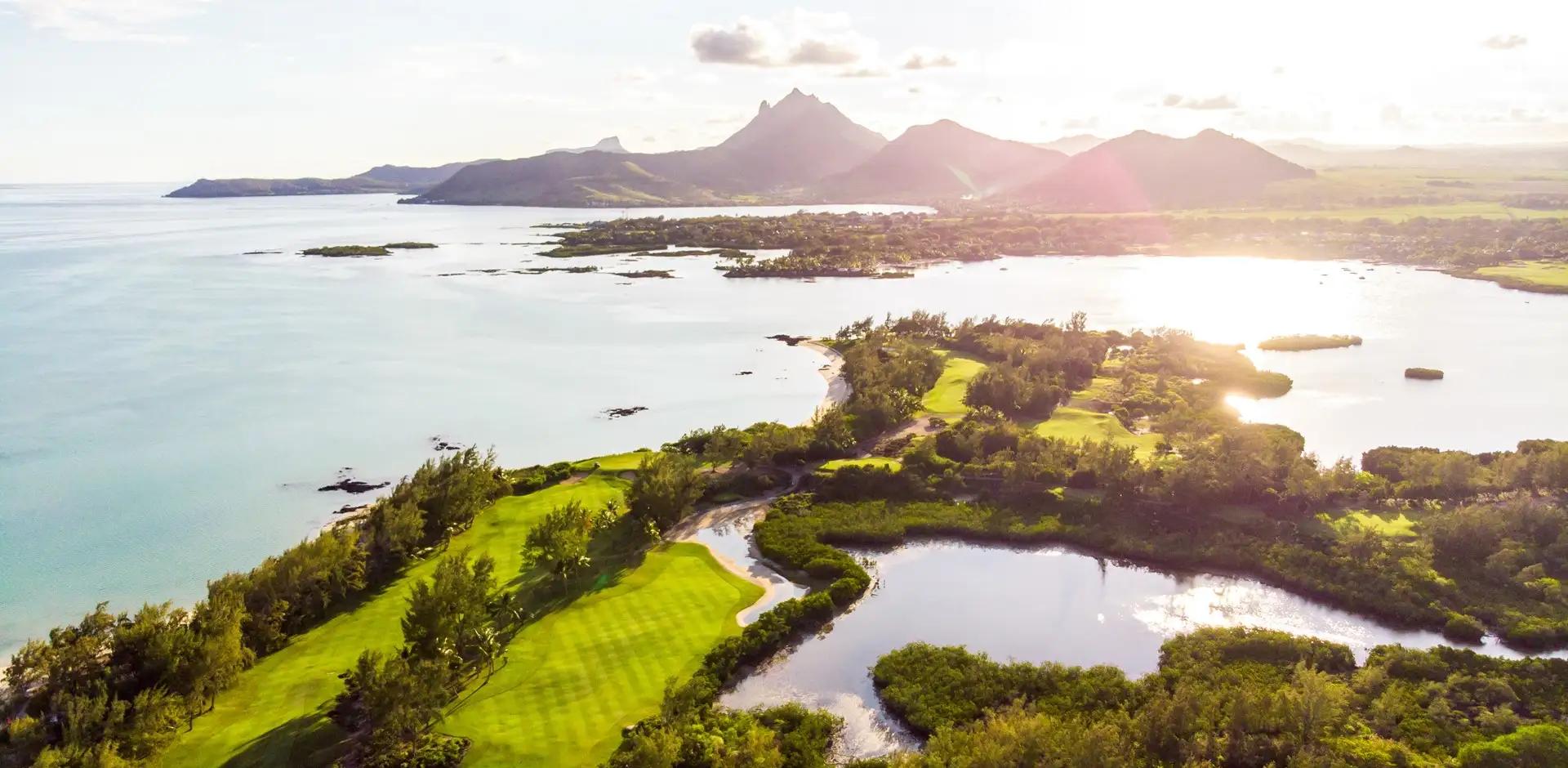 Aerial view of a well maintained fairway with distant mountain views at Shangri La Touessrok
